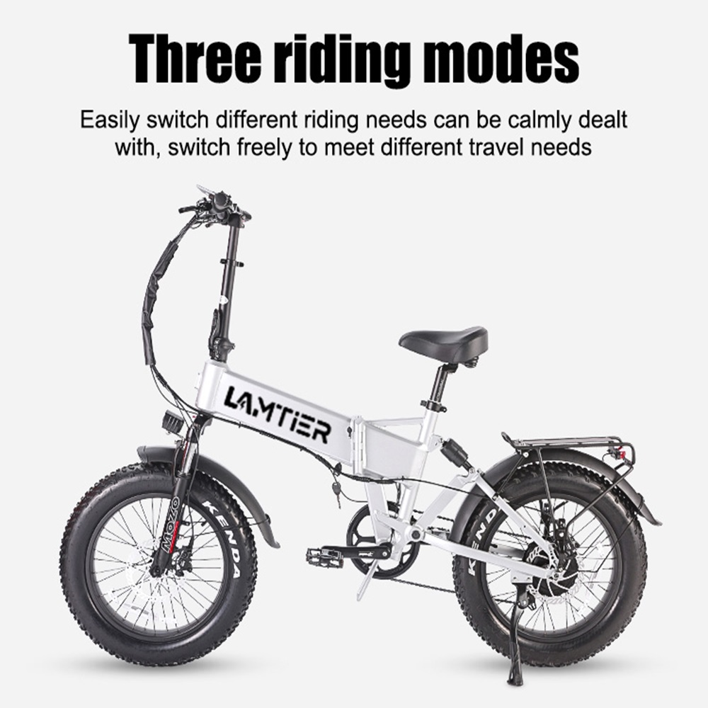 Bicicleta eléctrica blanca y plateada con neumáticos grandes, texto 'Three riding modes'.
