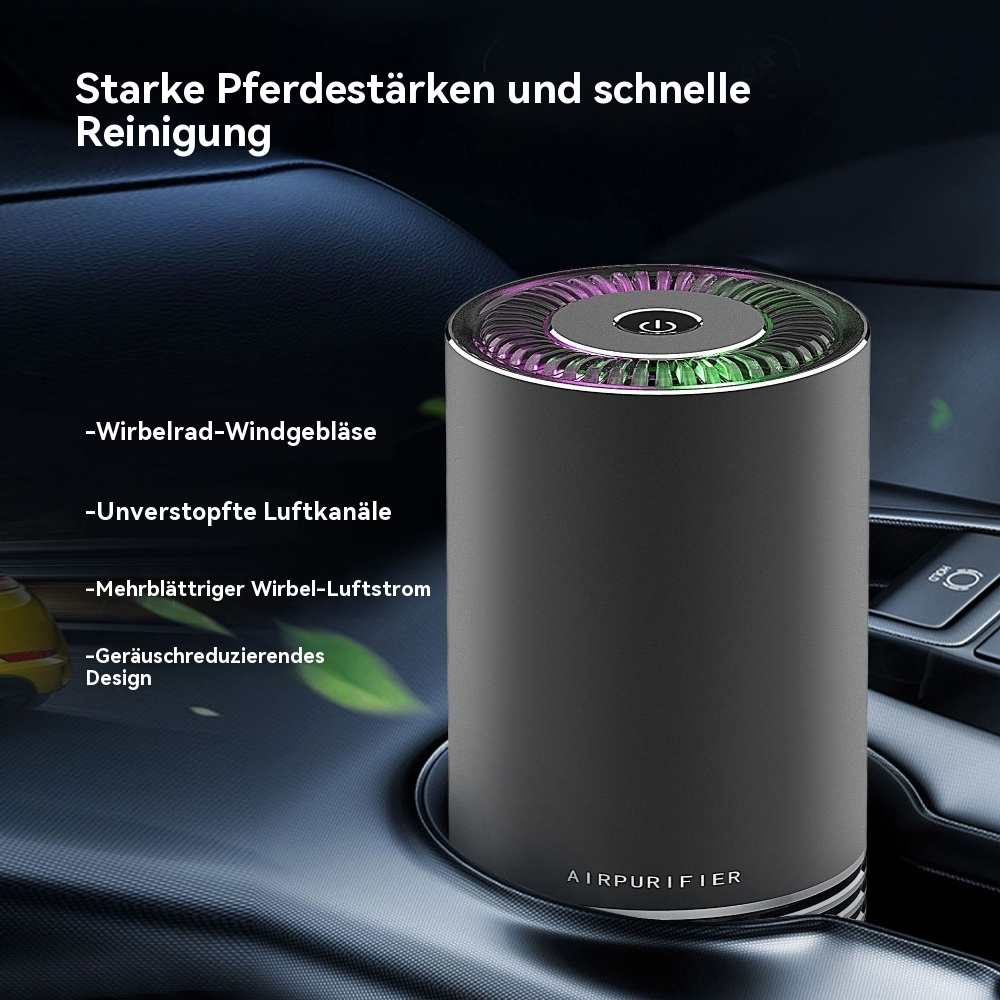 Luftreiniger im Auto. Schwarz und grau mit Lichtring oben. In einem Getränkehalter platziert.