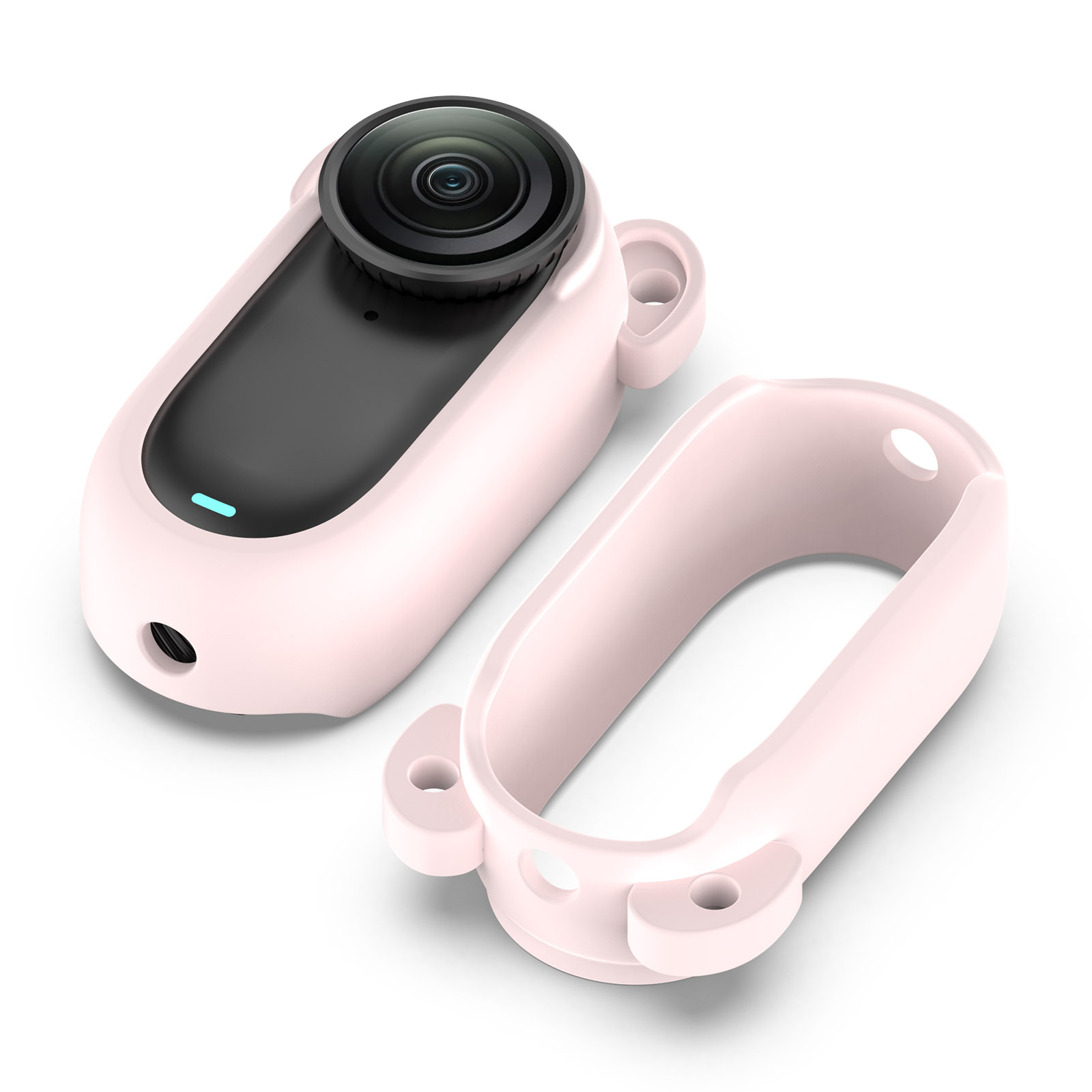 Una fotocamera rosa con custodia a orecchie di orso accanto alla custodia. Obiettivo nero, corpo nero.