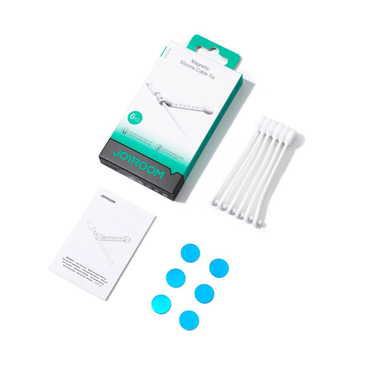 Eine weiße Box mit Kabelbindern, blauen Aufklebern und Anweisungen auf weißer Oberfläche.