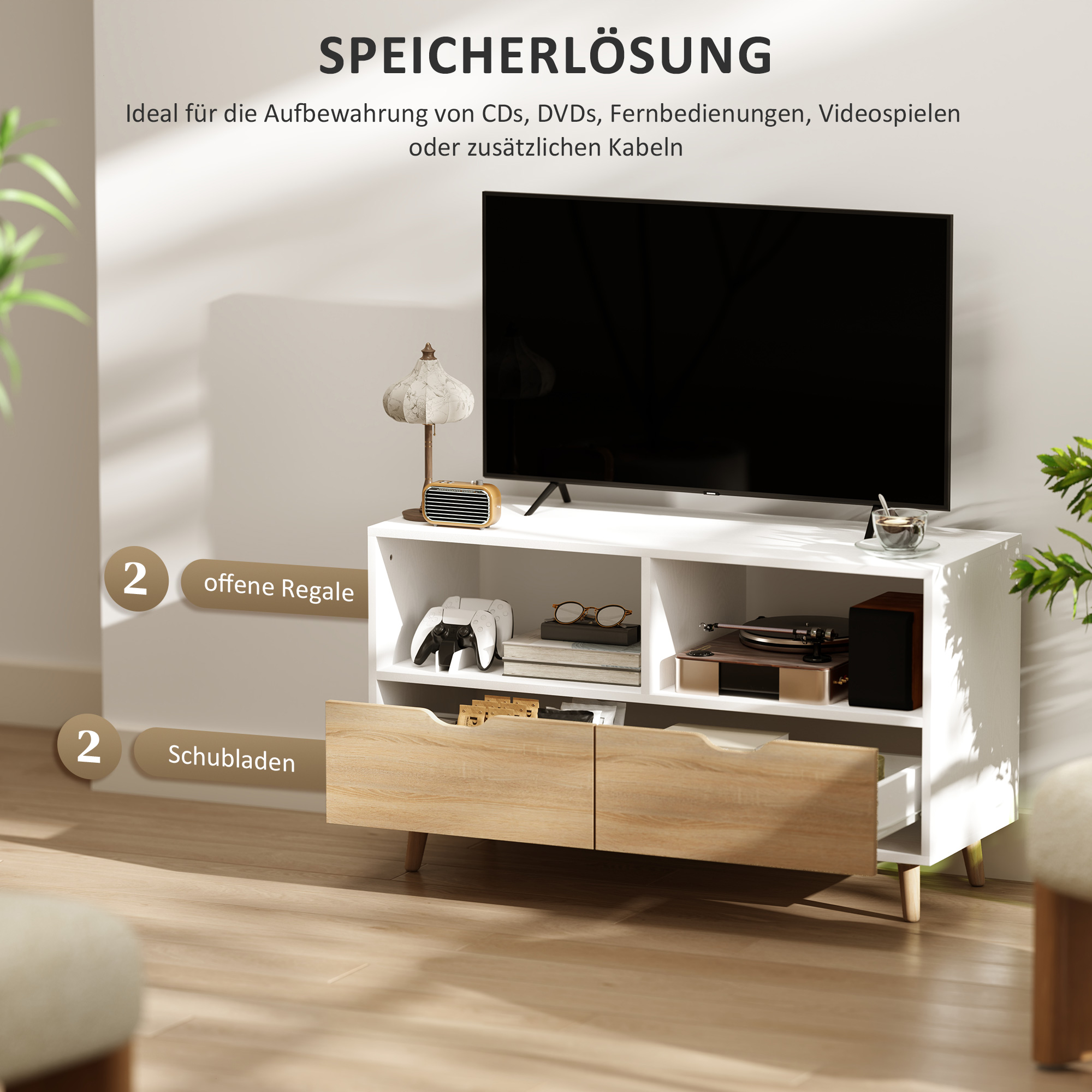 Ein weißer und holzfarbener TV-Ständer mit TV und Zubehör. Text auf Deutsch.