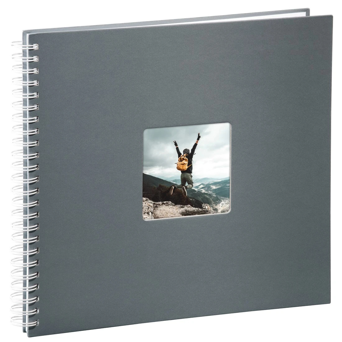 Szary album fotograficzny ze zdjęciem osoby skaczącej pośrodku, biała spirala.