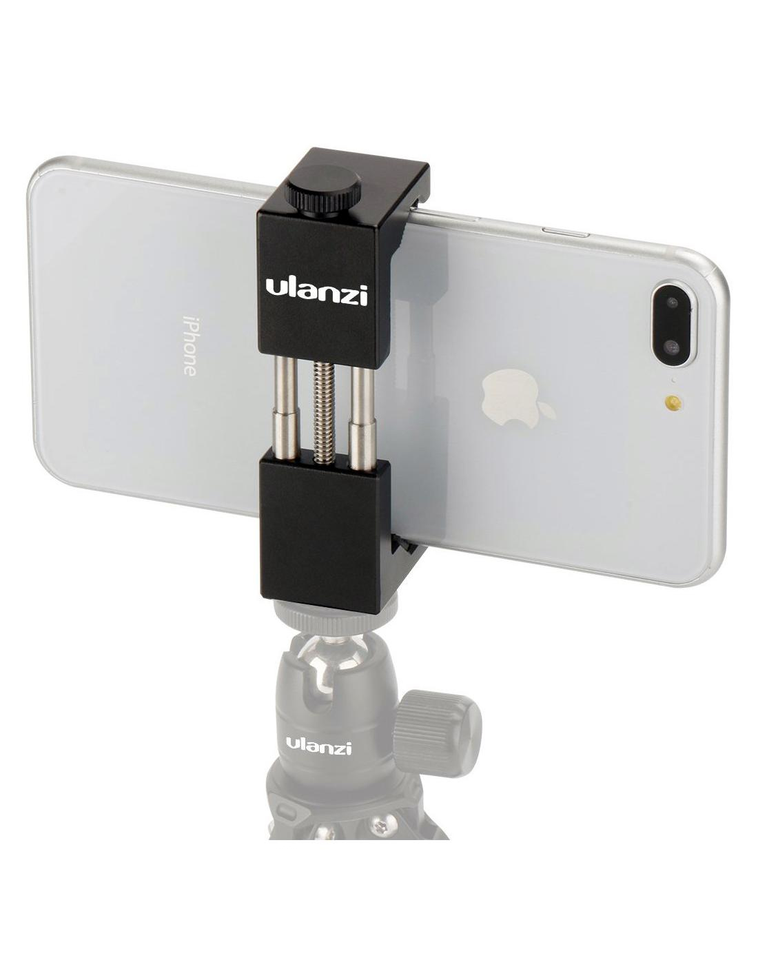 Un téléphone est monté sur un support. Le support est fixé à un trépied. Le téléphone est argenté.