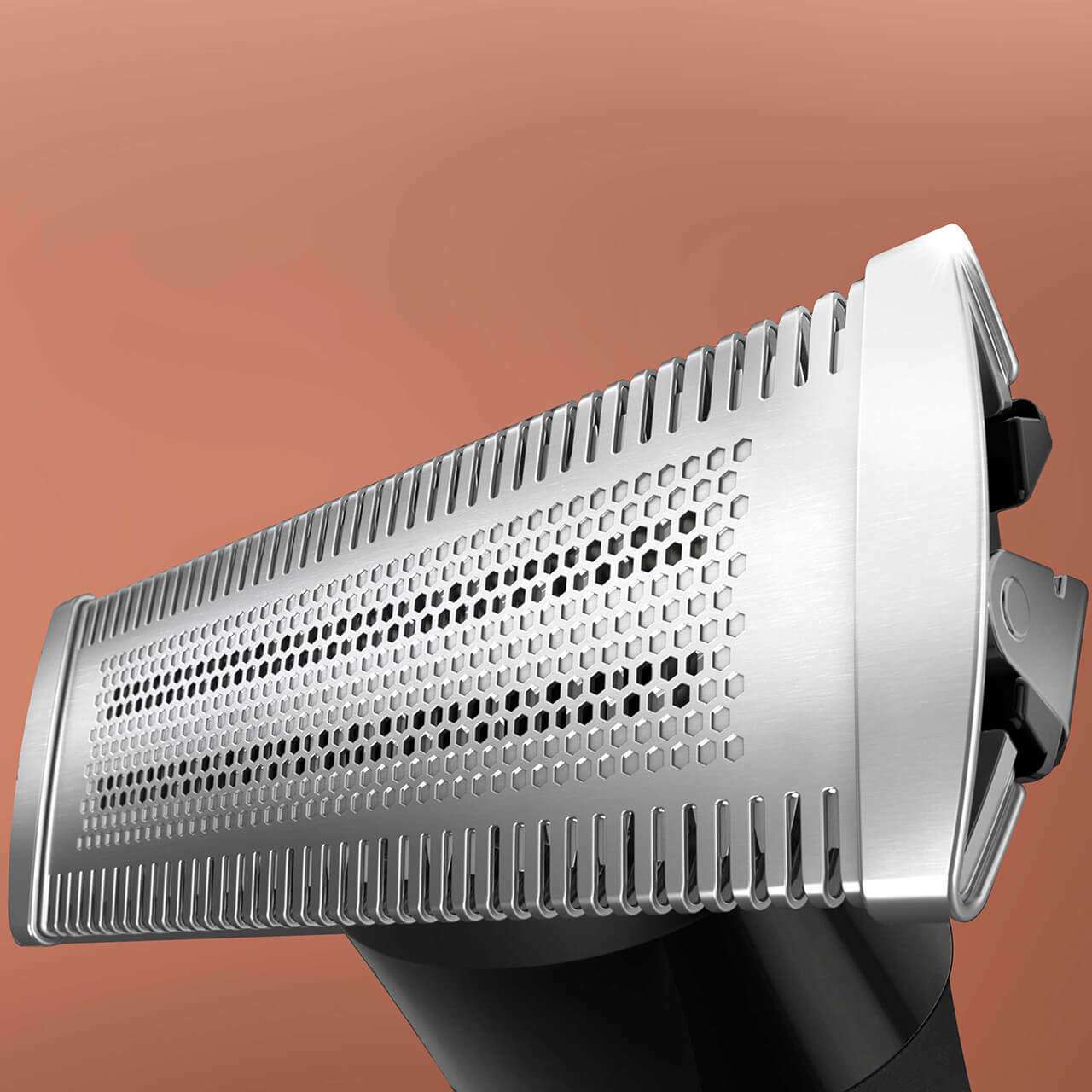 Close-up of a trimmer blade, with a brown background.