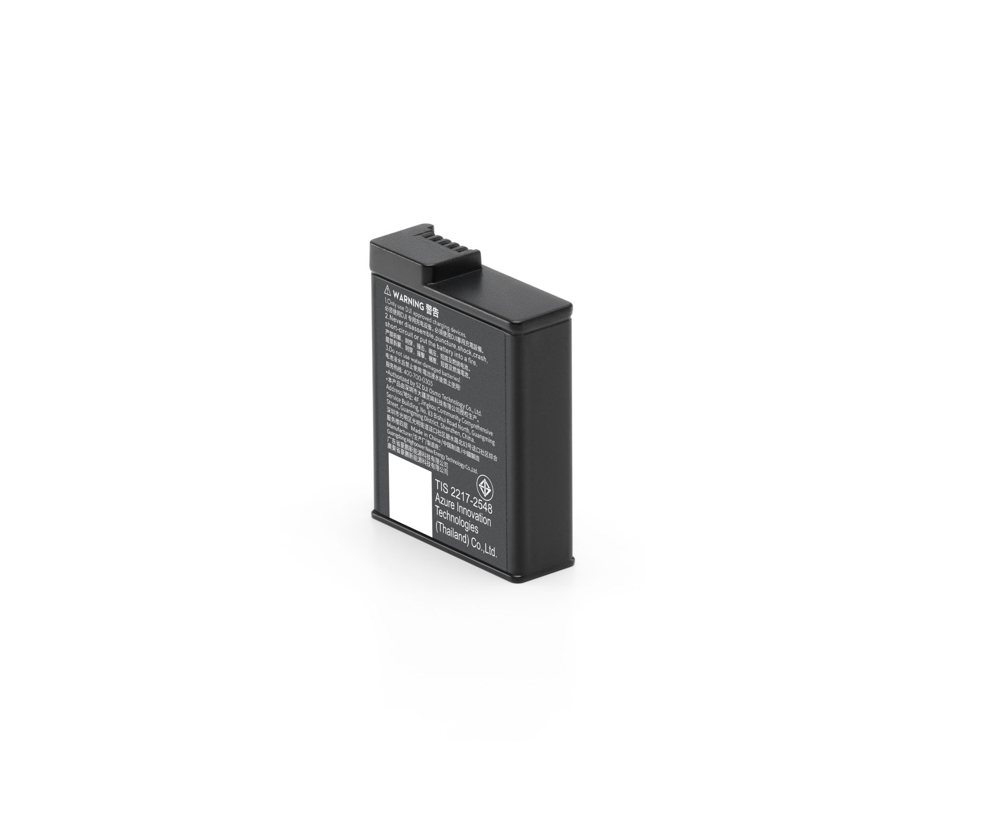 Una batteria nera con un'etichetta di avvertenza su sfondo bianco, angolata leggermente per mostrare il suo lato.