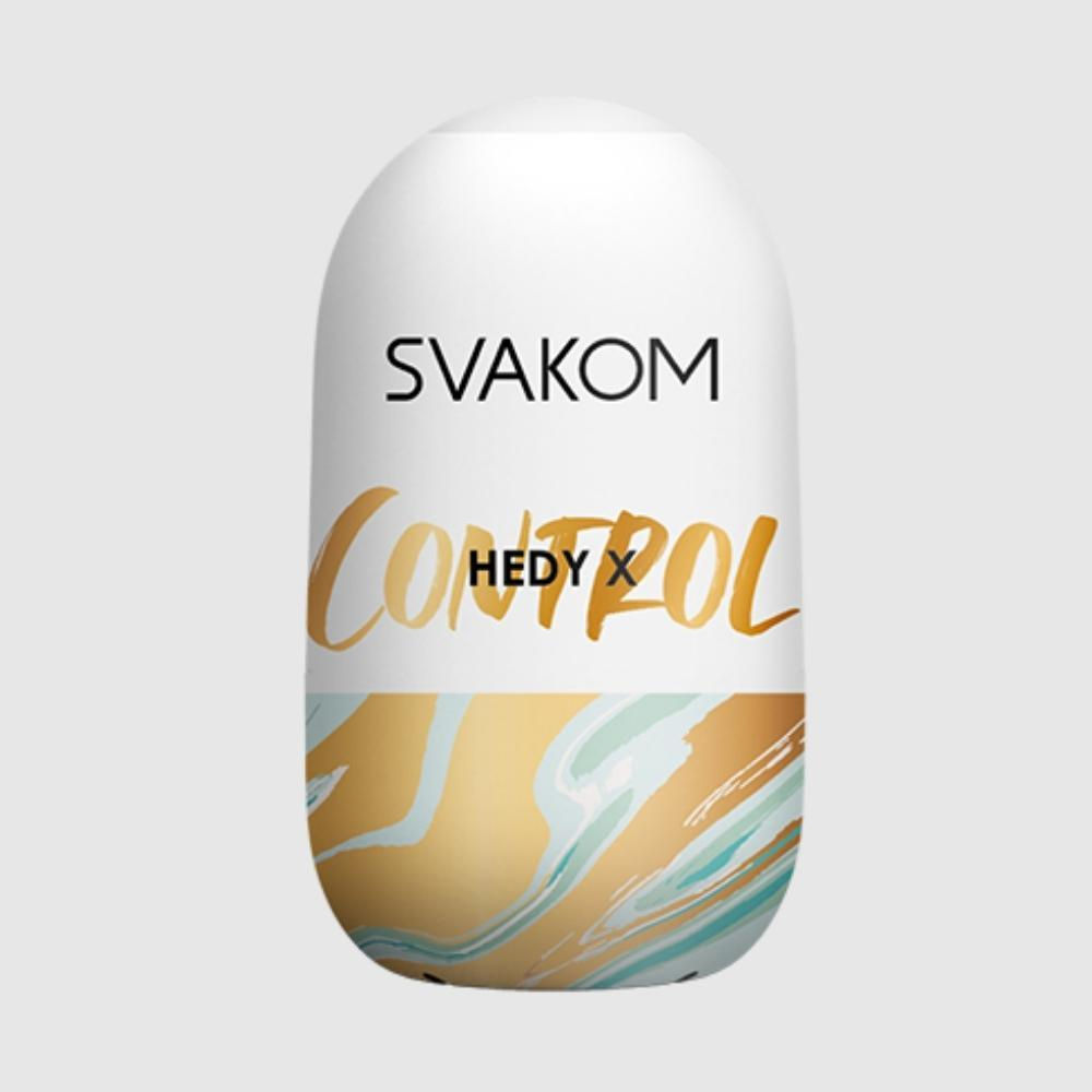 Biały produkt w kształcie owalu z marką SVAKOM i słowem CONTROL złotymi literami.