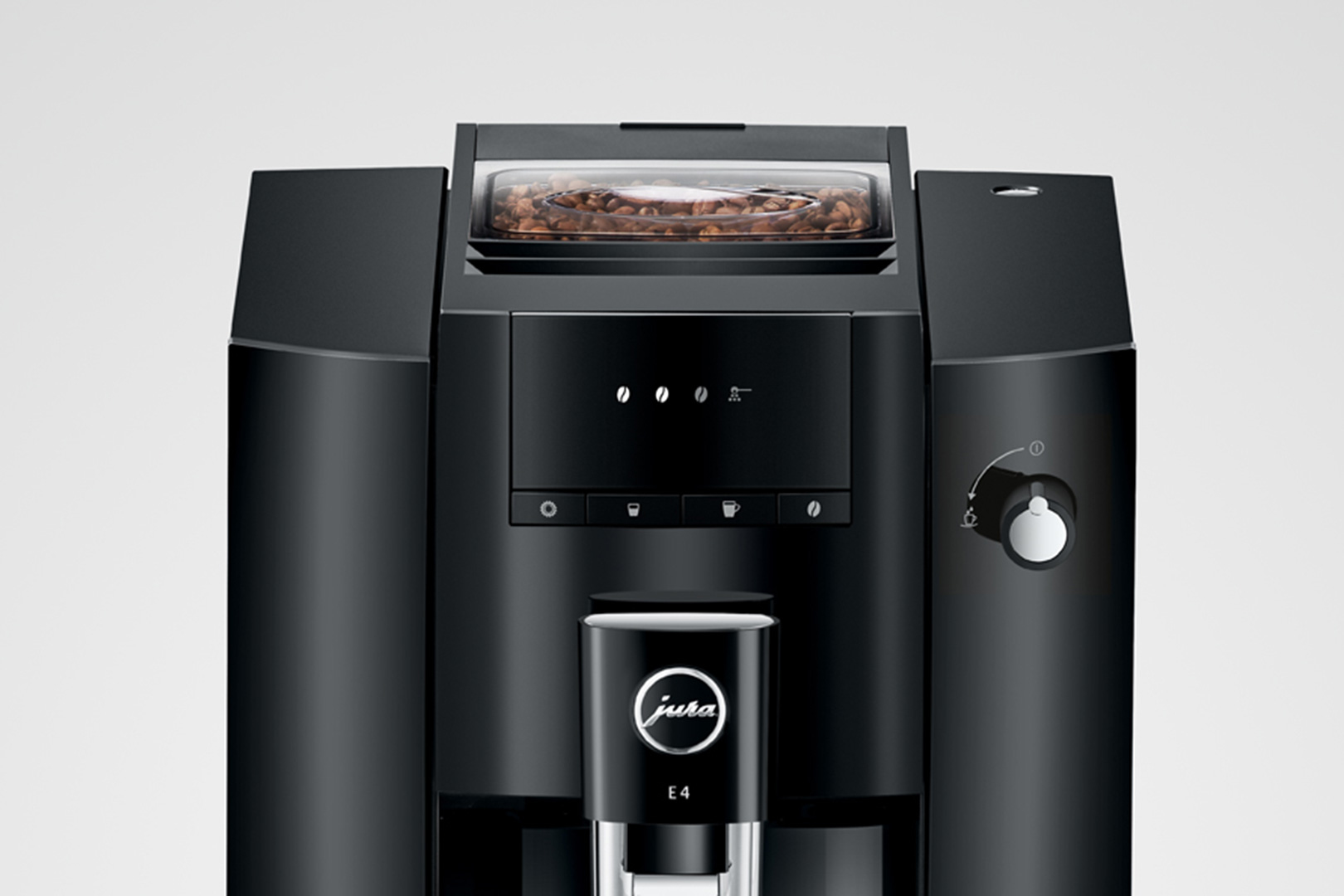 Máquina de café negra Jura E4 con granos, botones y el logo de Jura.