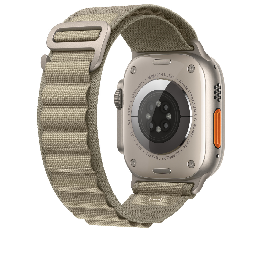 Apple Watch Ultra, vue arrière, bracelet beige. L'arrière affiche les détails: Titane, Cristal.