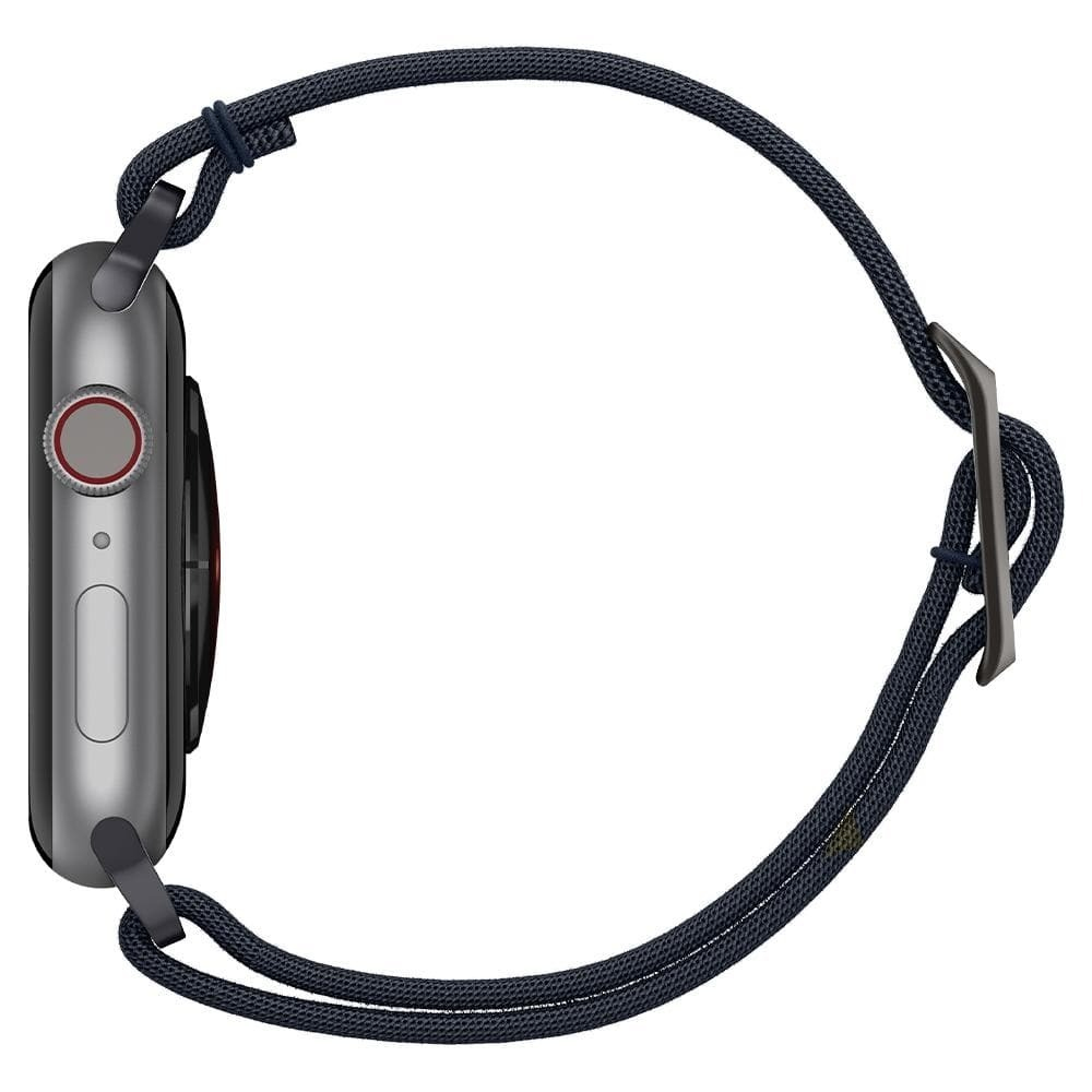 Apple Watch side view with a blue fabric band and the face displaying time.