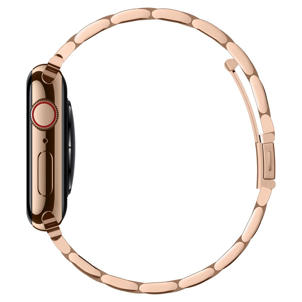 Vista laterale di un Apple Watch dorato con cinturino a maglie dorate, su sfondo bianco.