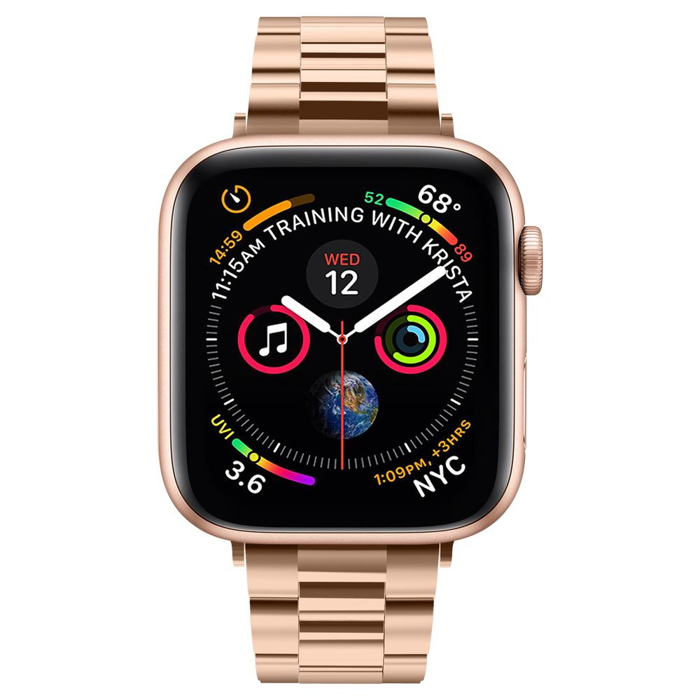 Un Apple Watch dorato con cinturino in metallo dorato che mostra il quadrante con l'ora e i dati di allenamento.