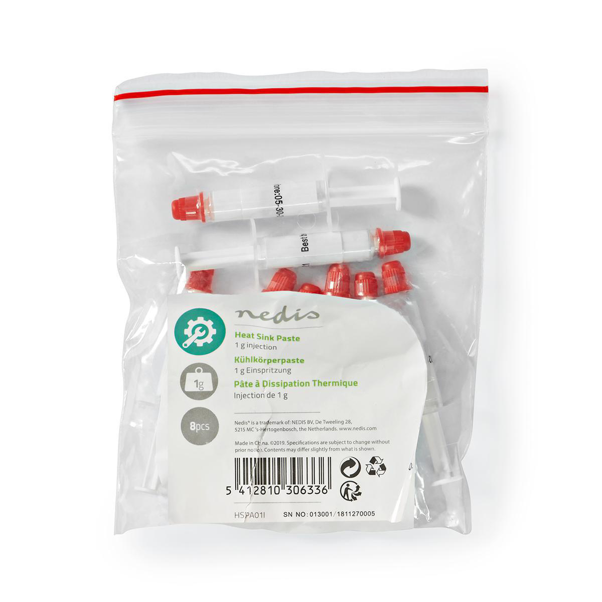 Plastikowa torba z dwiema strzykawkami, czerwonymi nakrętkami i białą etykietą z tekstem o paście termicznej.