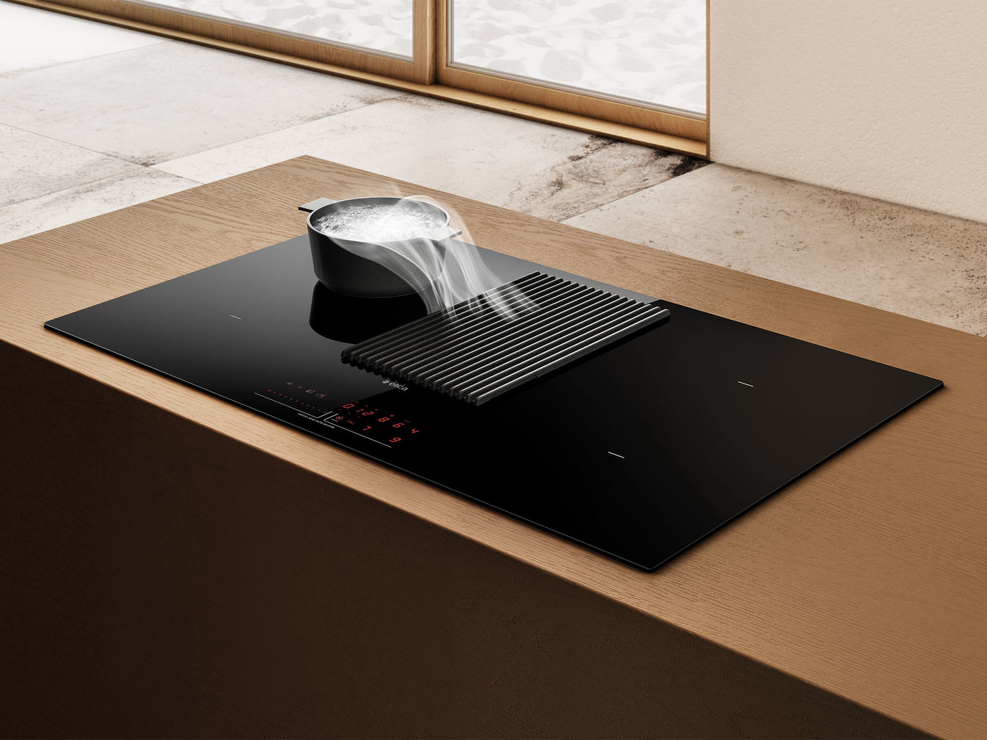 Cocina moderna con vitrocerámica, vapor y encimera de madera.