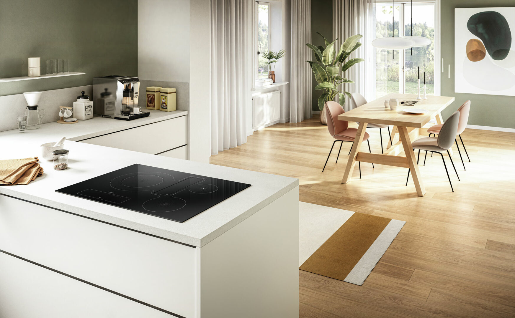 Nowoczesna kuchnia z czarną płytą grzejną na białej wyspie i stołem jadalnym. Drewniana podłoga i jasne ściany.