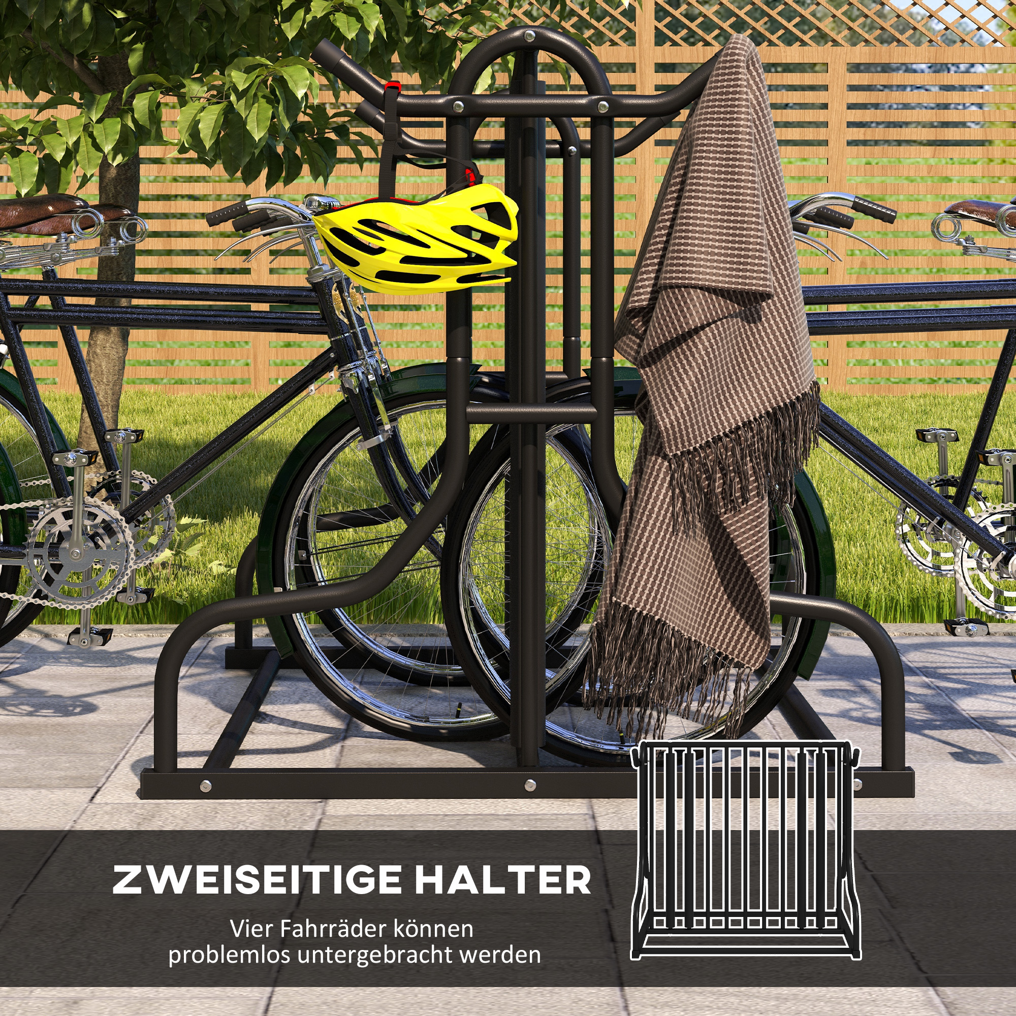 Fahrradständer mit zwei Fahrrädern, einem gelben Helm und einer Decke vor einem Zaun.