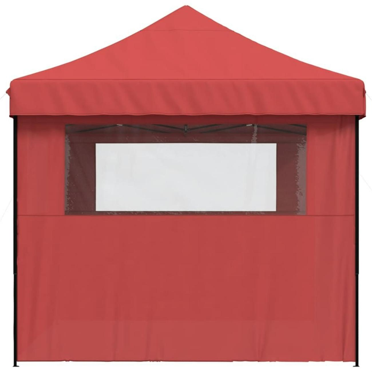 Rotes Vordachzelt mit einem einzigen weißen Fenster.