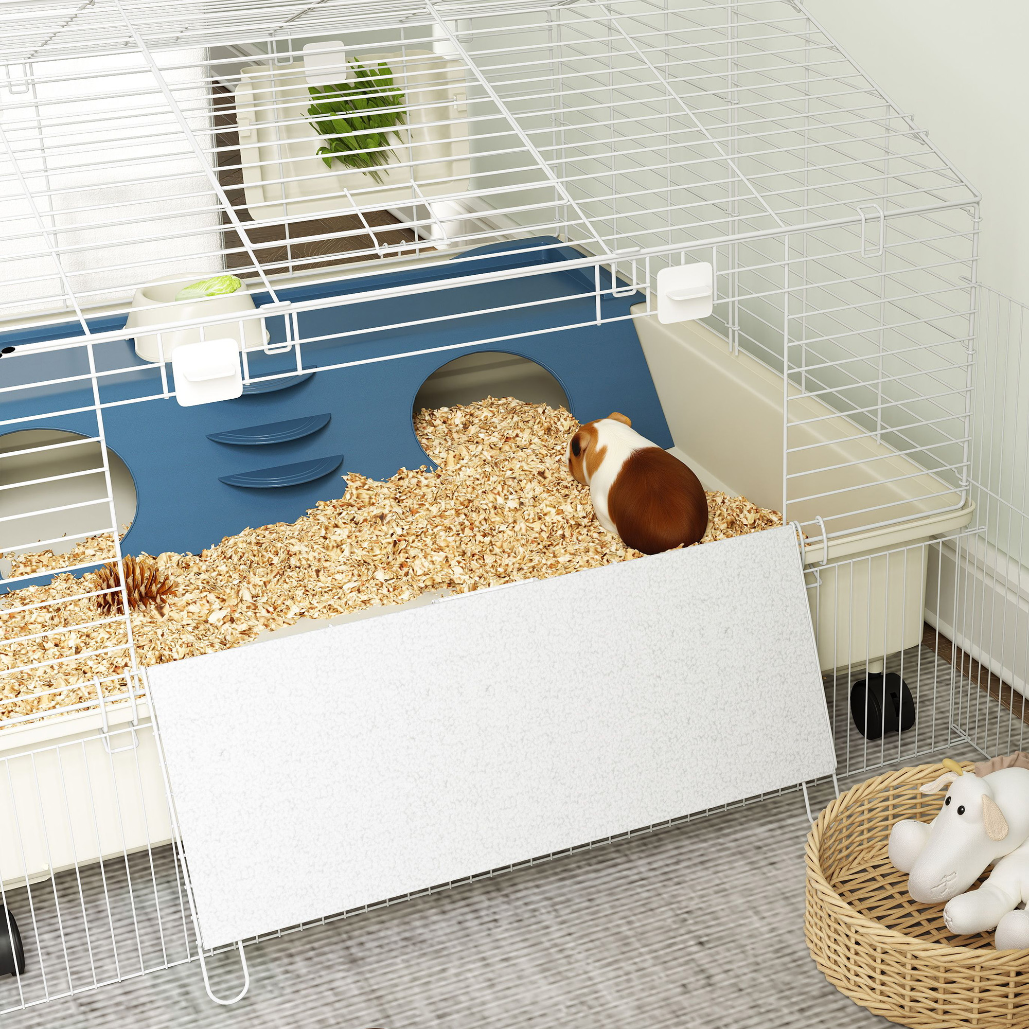 Ein Käfig für Kleintiere mit einem Meerschweinchen darin. Weiß und blau.