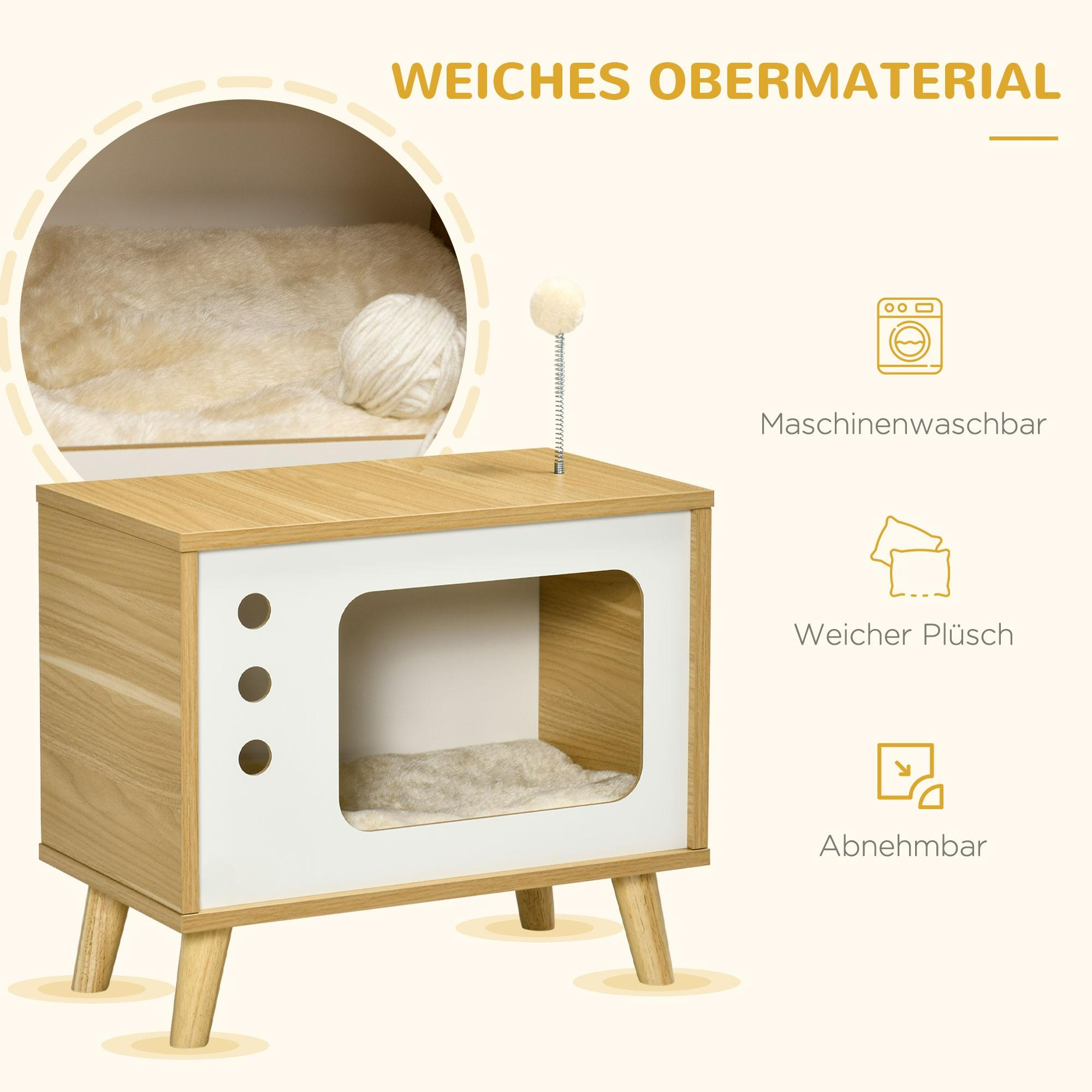 Ein hölzernes Haustierhaus mit einem Katzenbett und einem Spielzeug. Es hat eine weiße Tür und ein flauschiges Innere.