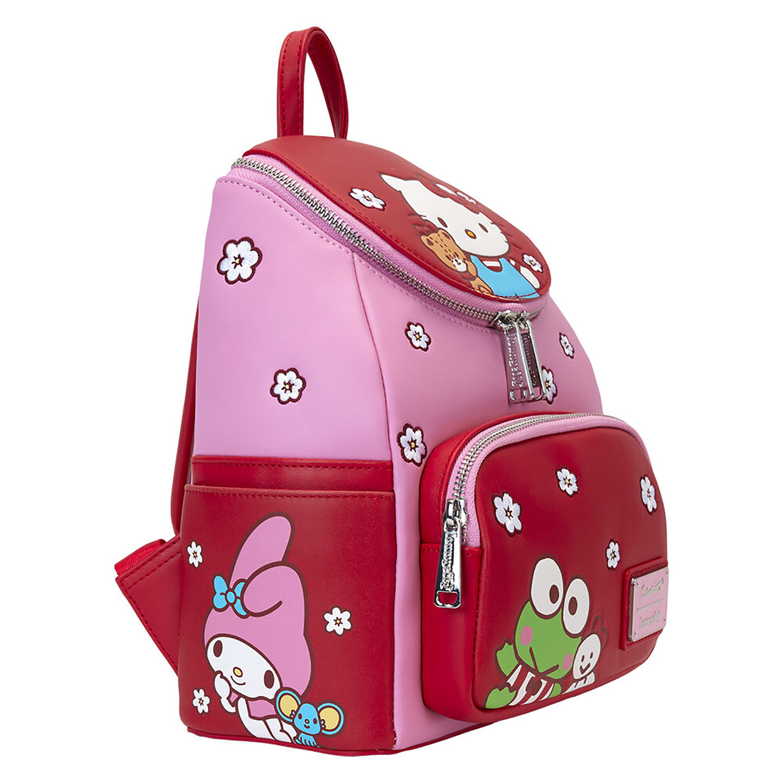 Mochila rosa con Hello Kitty y My Melody. Tiene un bolsillo delantero rojo con Keroppi. Hay diseños de flores blancas.
