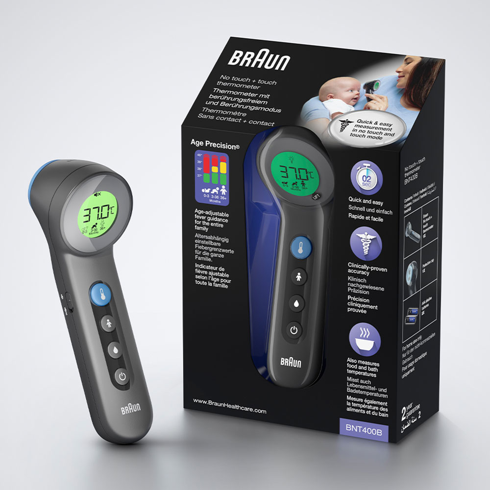 Braun Thermometer und Verpackung. Anzeige zeigt 37,0°C. Box enthält Infos zur Benutzung am Baby.