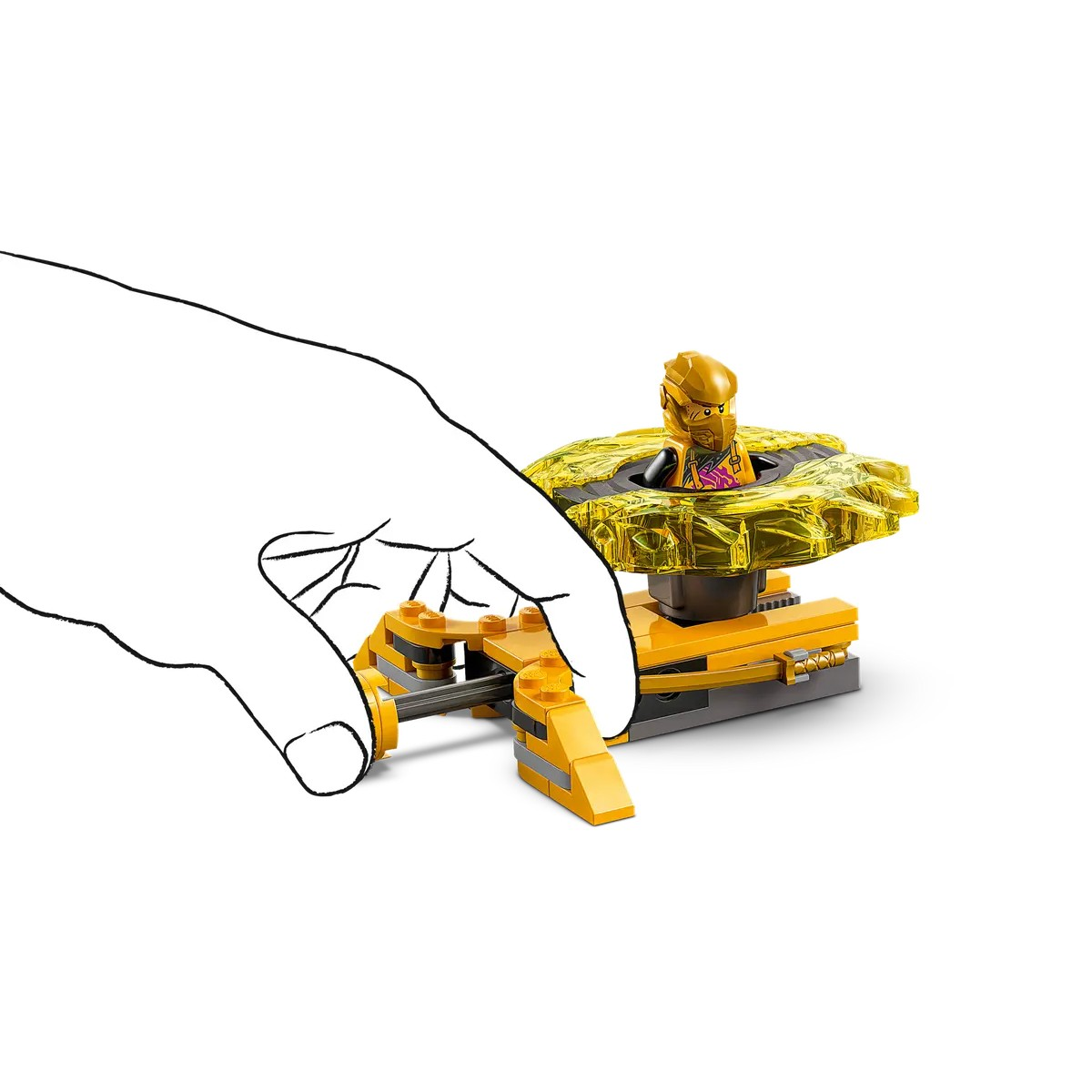 Una mano interactuando con un juguete Lego, con una figura dorada. El fondo es blanco.
