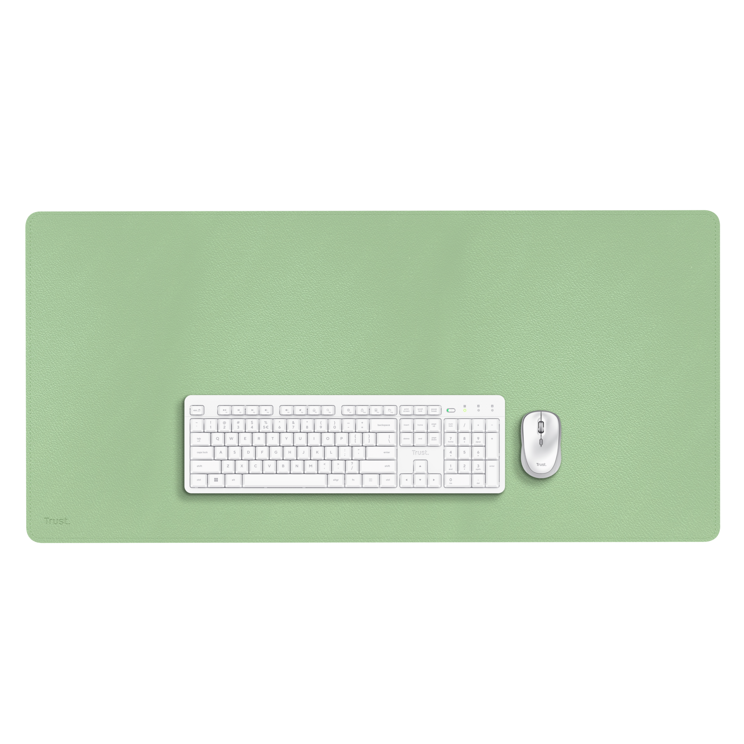 A green desk pad with a keyboard and a mouse. The surface is smooth. The background is plain.