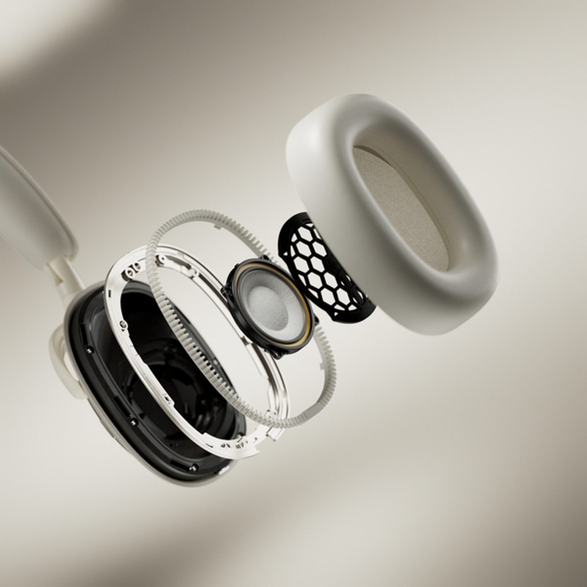 Widok rozstrzelony białych słuchawek. Pokazano elementy. Beżowe tło.