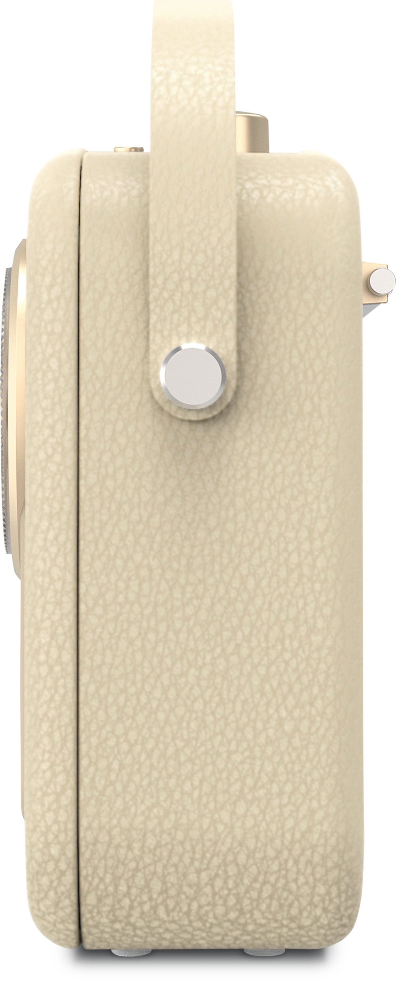 Kremowe radio w stylu retro z uchwytem. Radio jest w widoku z boku.