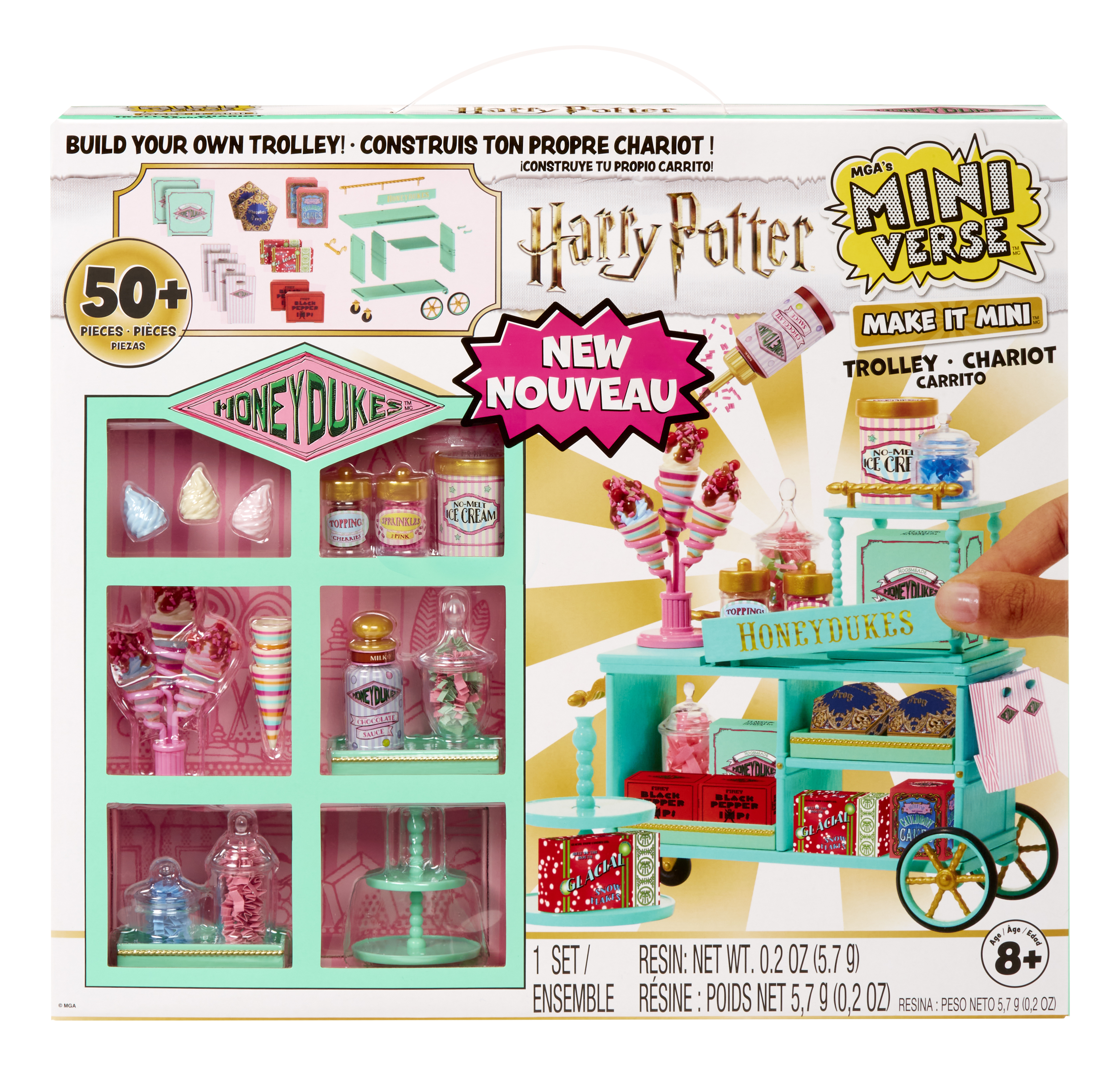 Zestaw w pudełku z wózkiem Honeydukes. Opakowanie przedstawia dłoń dodającą coś do wózka.