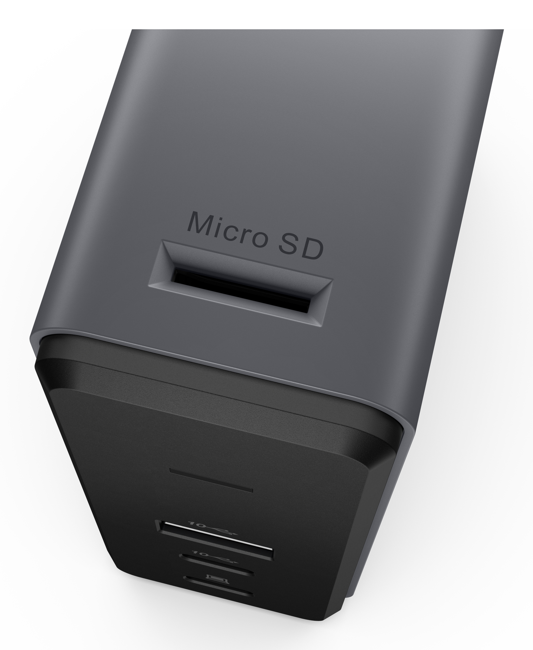 Nahaufnahme eines grau-schwarzen Geräts, mit einem Micro-SD-Steckplatz und USB-Anschlüssen.