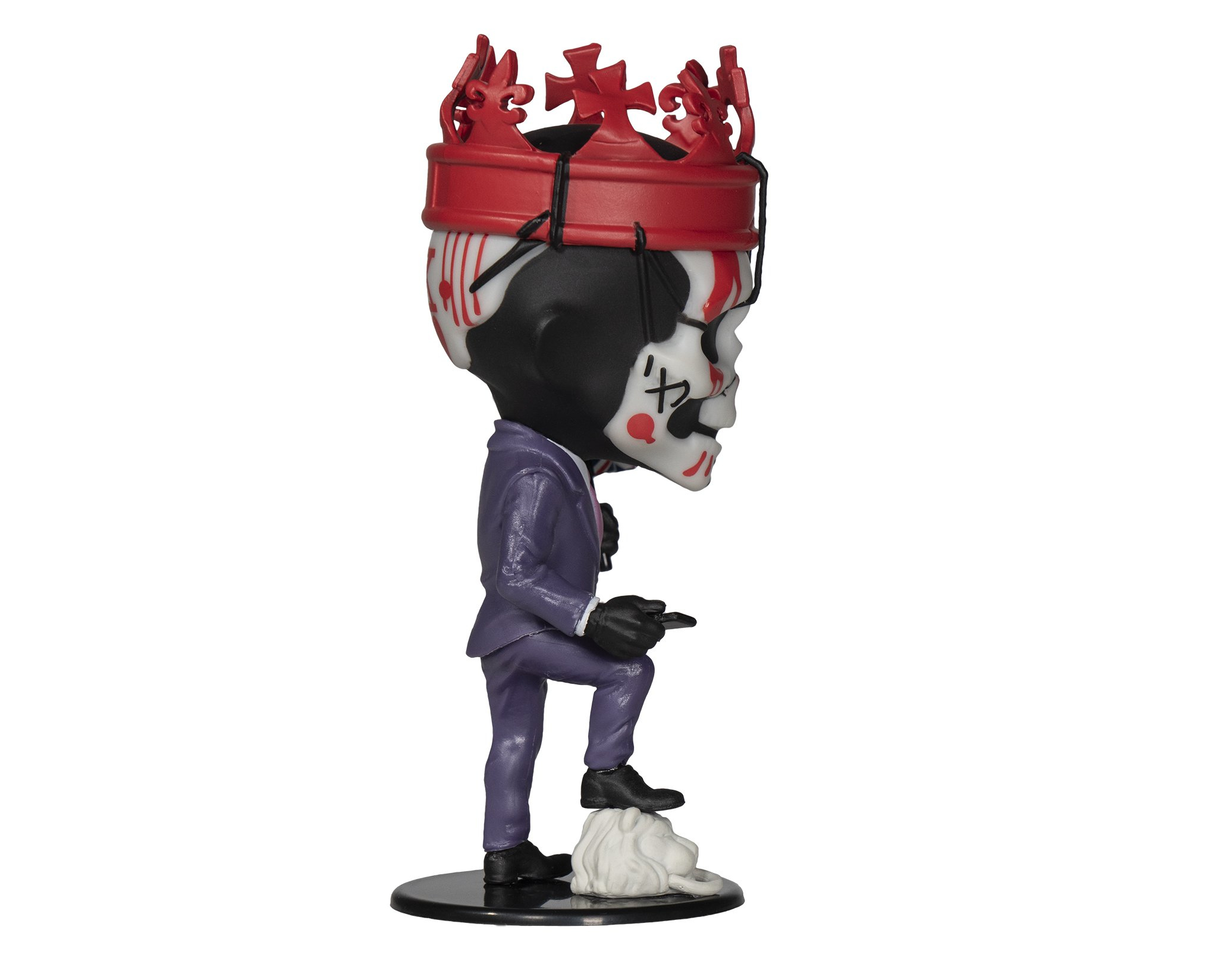 Eine Figur eines Mannes mit Totenkopfgesicht und roter Krone. Der Mann trägt einen lila Anzug.