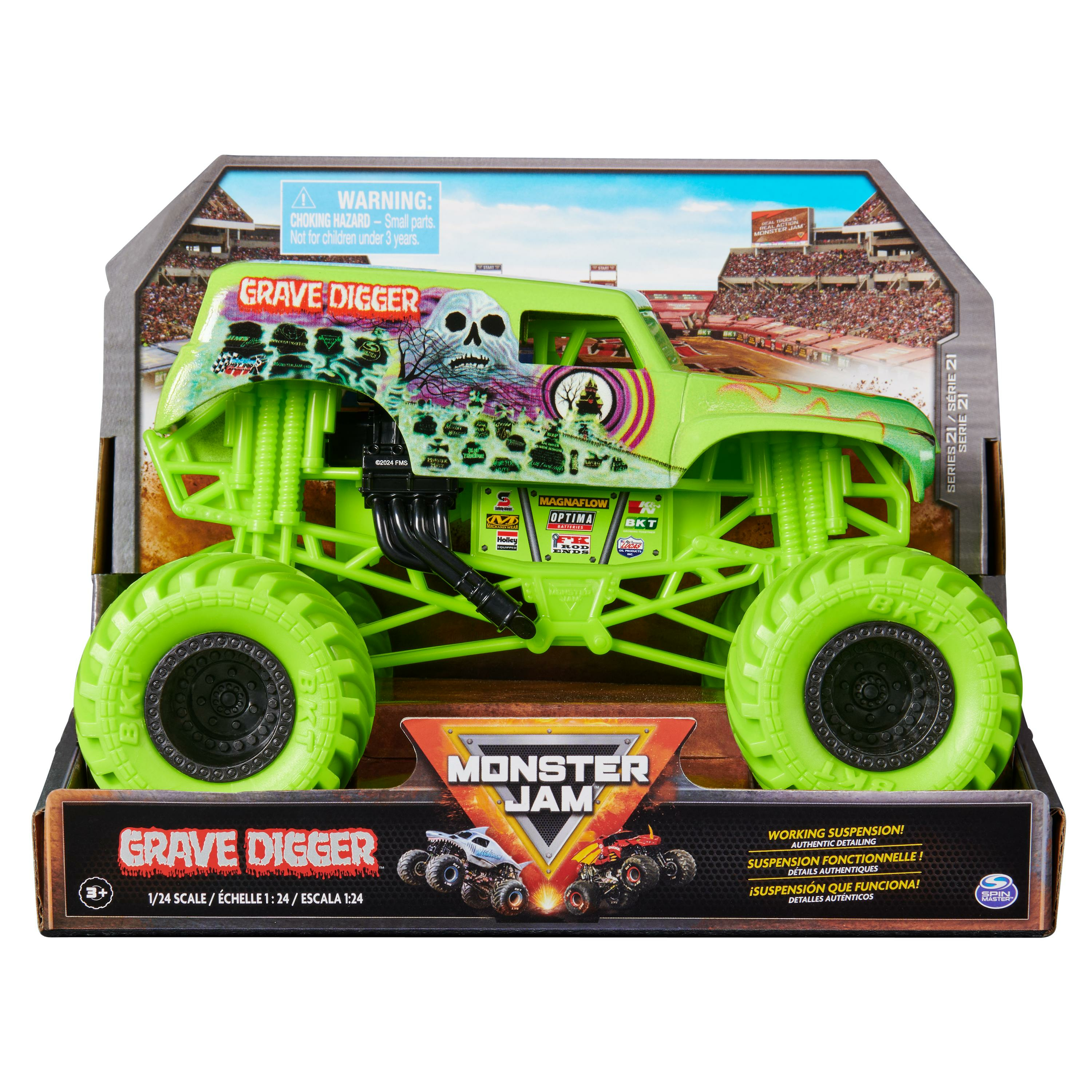 Un camión monstruo Grave Digger verde de juguete en una caja. La caja presenta el camión y una escena de carreras.
