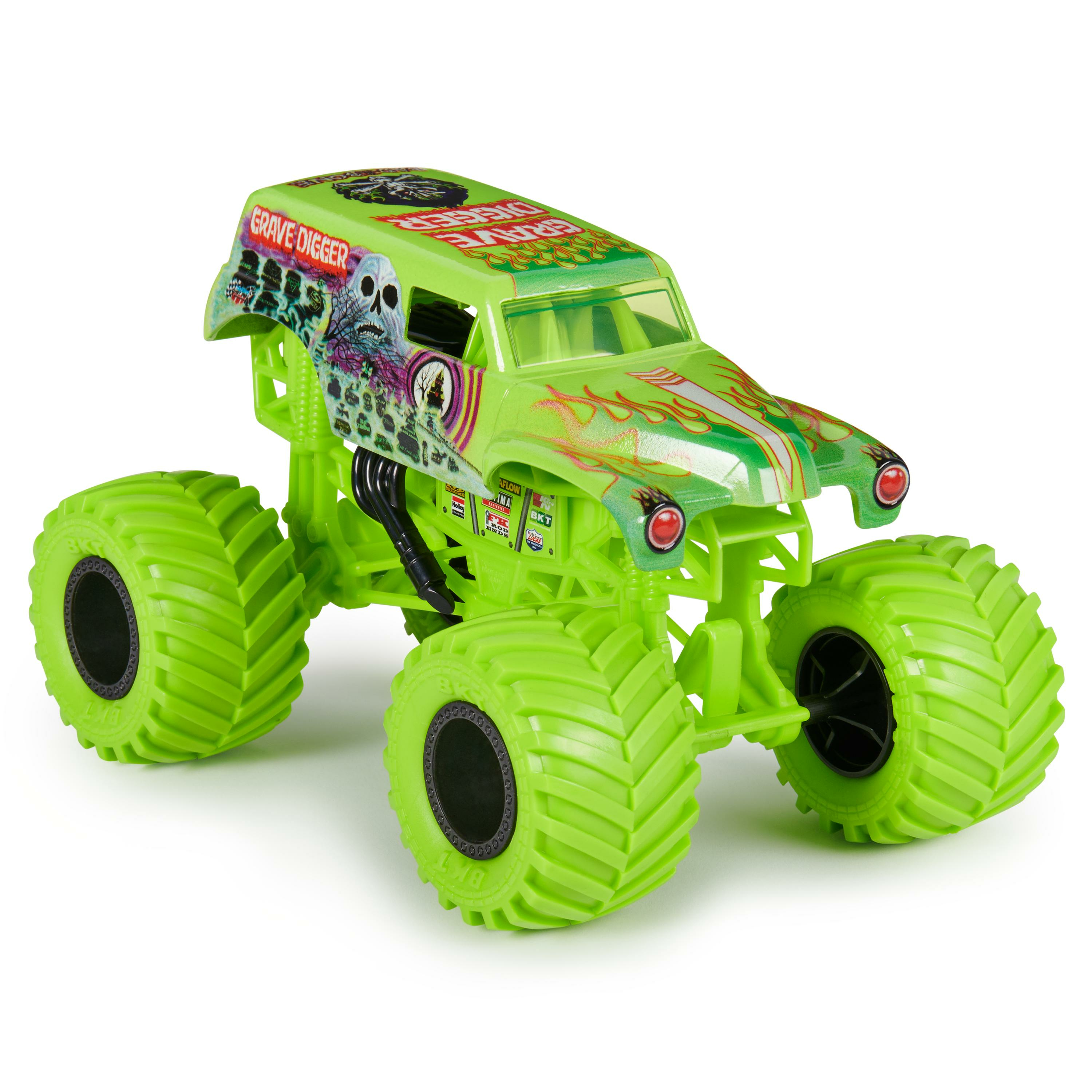 Un camión monstruo Grave Digger verde de juguete. El camión tiene ruedas grandes y un diseño de calavera.