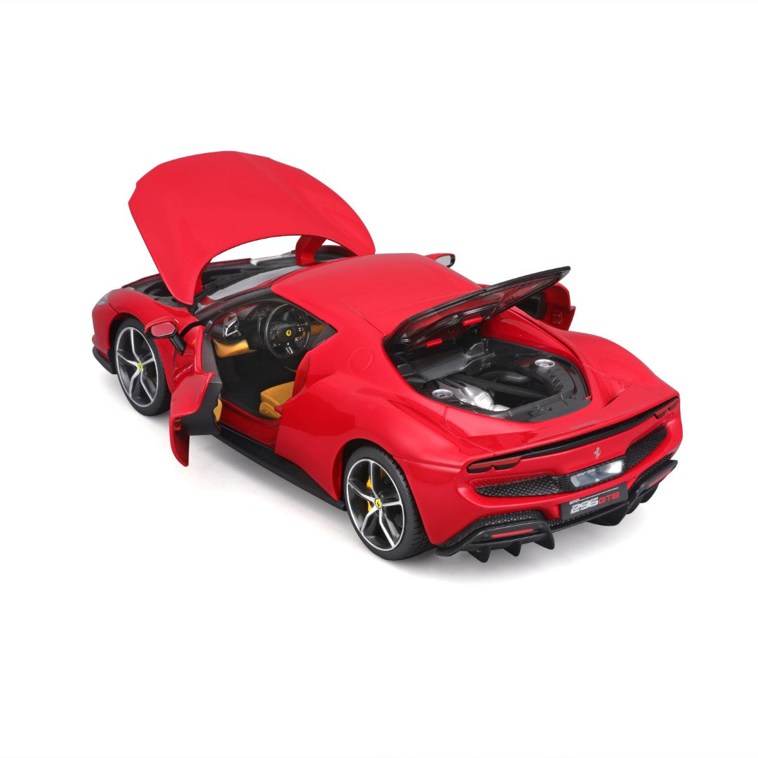 Widok z boku czerwonego samochodu wyścigowego z logo sponsorów.