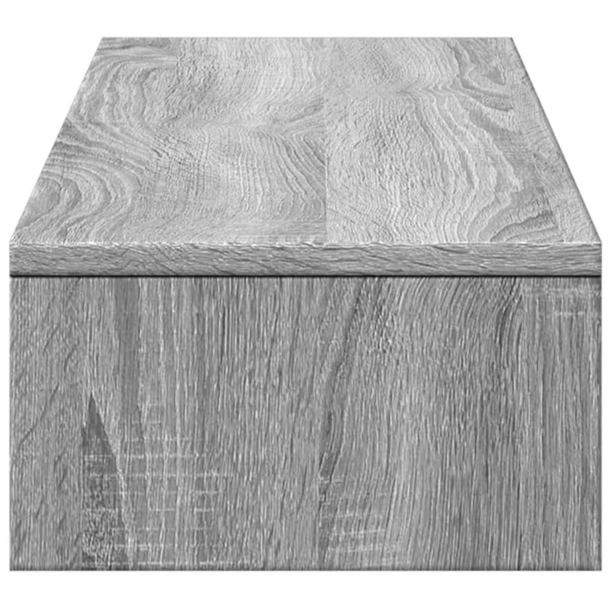 Nahaufnahme einer grauen Holz-Tischplatte mit Holzmaserung.