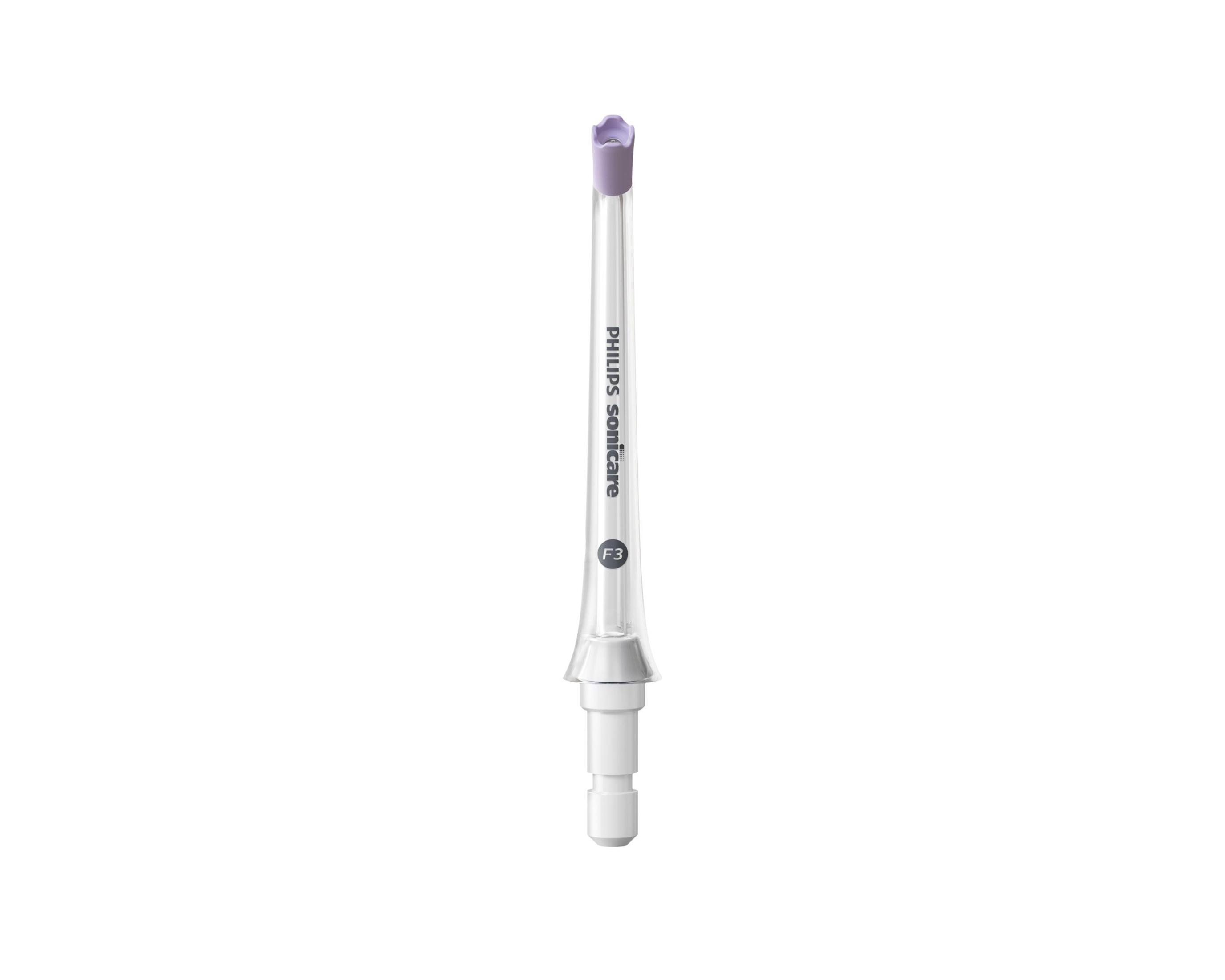 Mor uçlu, beyaz ve şeffaf bir Philips Sonicare diş fırçası başlığı, beyaz zemin üzerinde izole edilmiş.