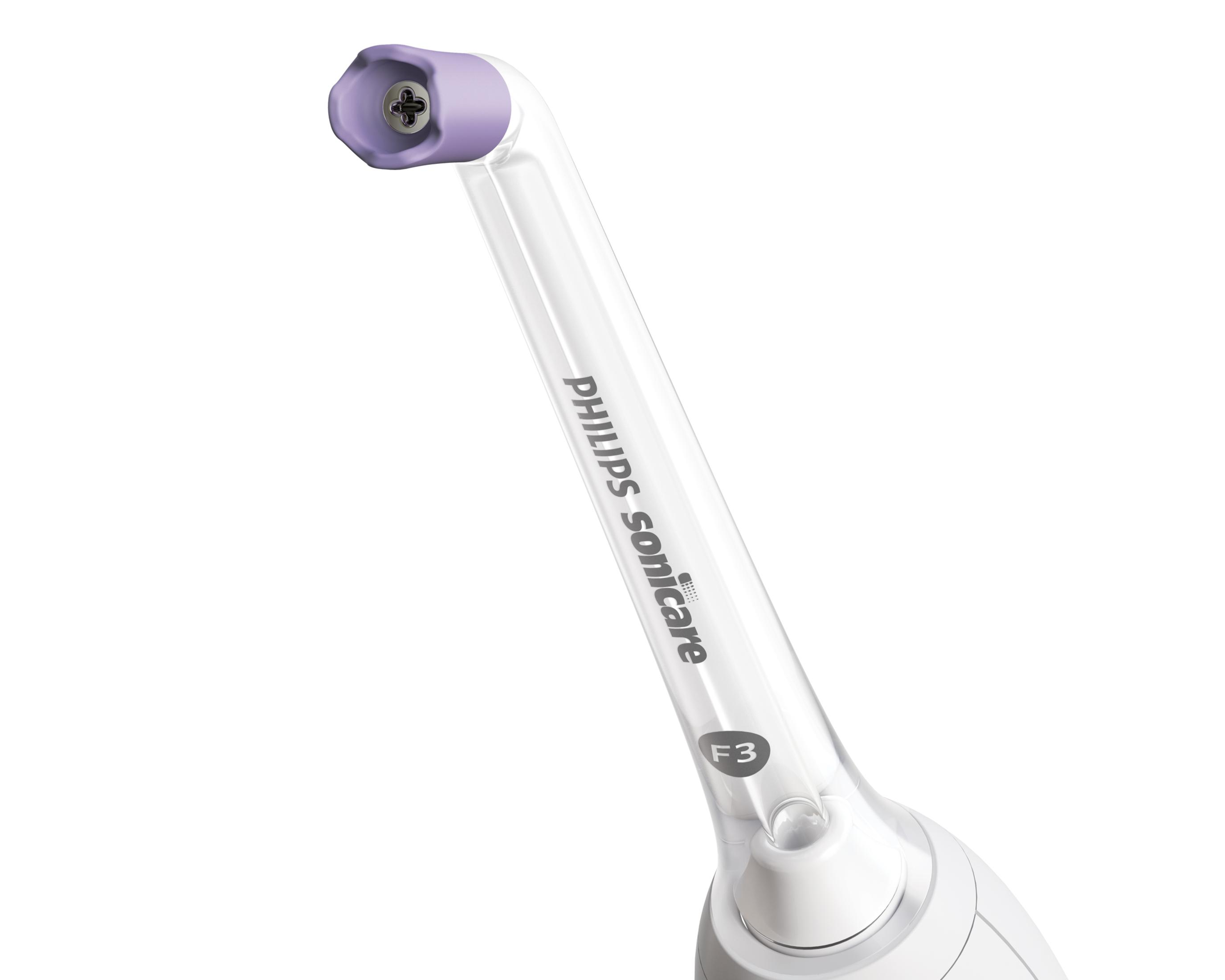 Mor açılı uçlu beyaz ve şeffaf bir Philips Sonicare diş fırçası başlığının yakın çekimi.