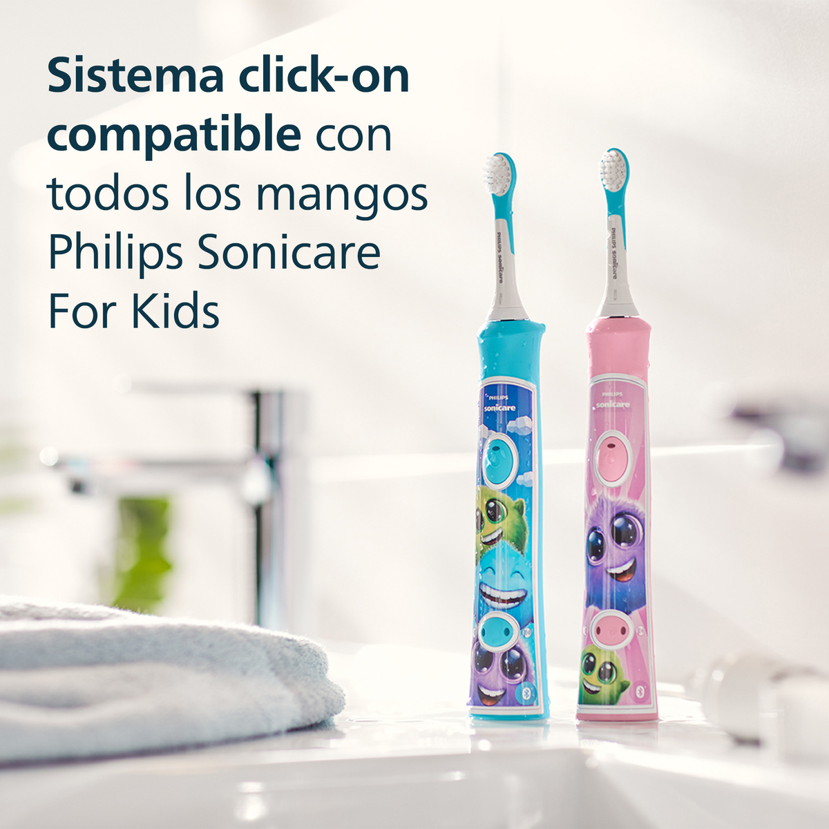 Dwie szczoteczki do zębów Philips Sonicare dla dzieci, niebieska i różowa, z postaciami z kreskówek.