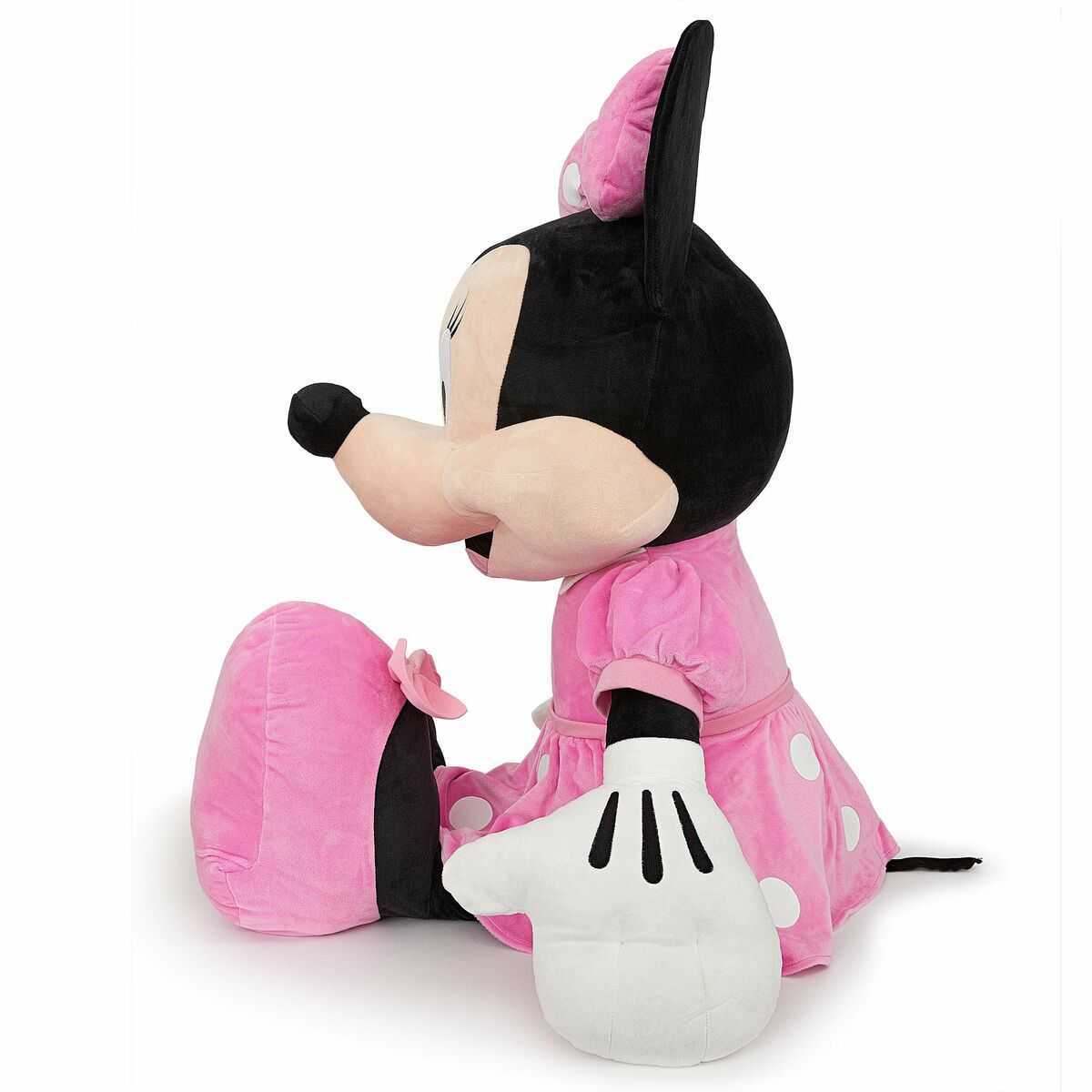 Minnie Mouse Stofftier sitzt mit weißen Punkten auf ihrem rosa Kleid und Handschuhen.