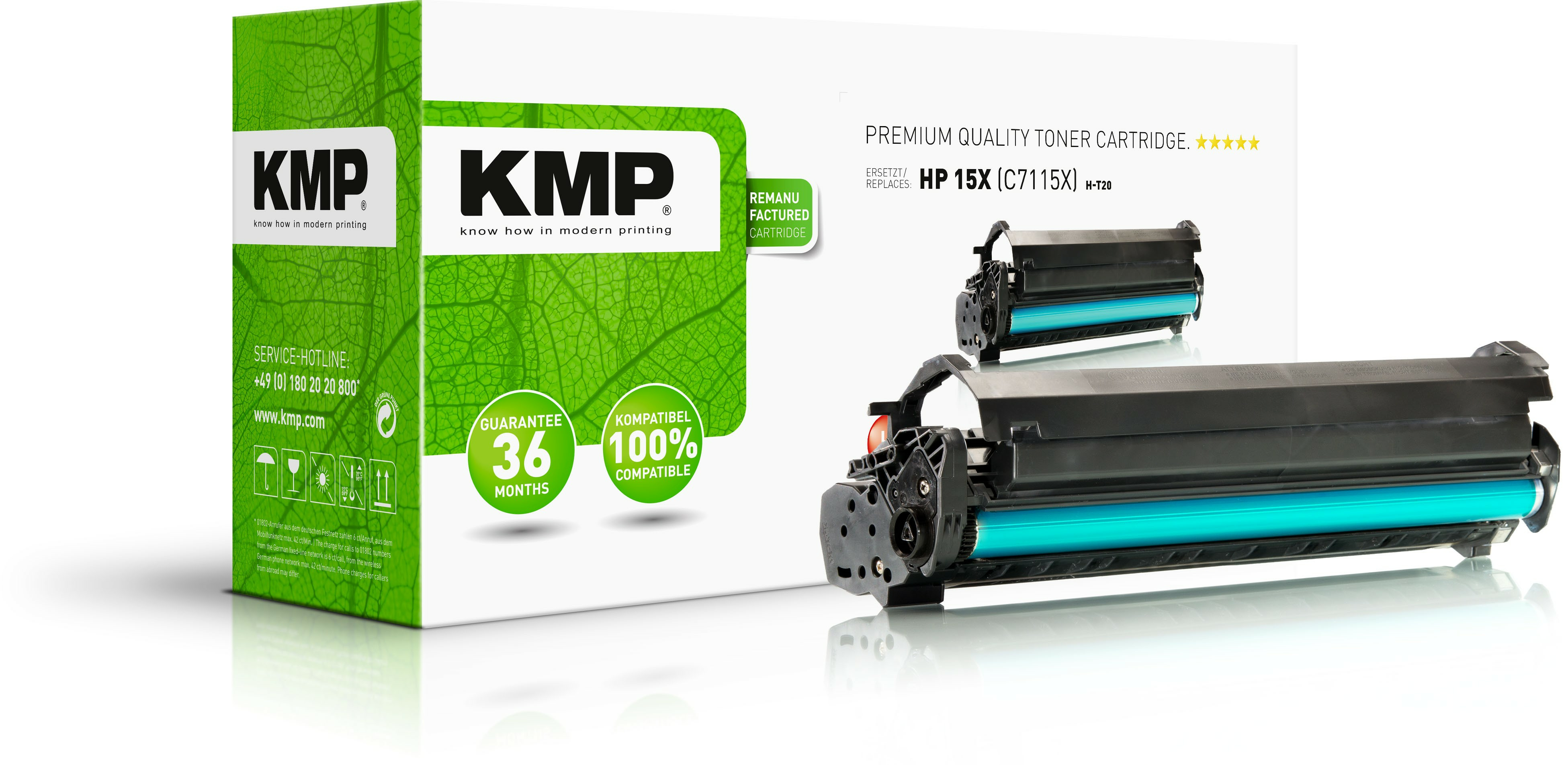 Una scatola di toner KMP verde e bianca e due cartucce toner su una superficie bianca.