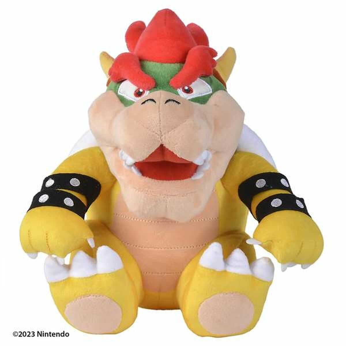 Primo piano di un peluche di Bowser in giallo e rosso, con dettagli neri. Ha un guscio rosso.