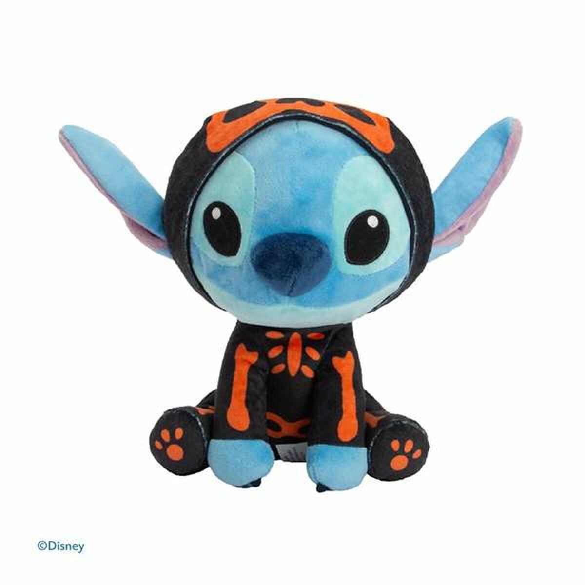 Ein blauer Stitch-Plüsch in einem Skelett-Kostüm, sitzt auf weißem Hintergrund. Orange und Schwarz.