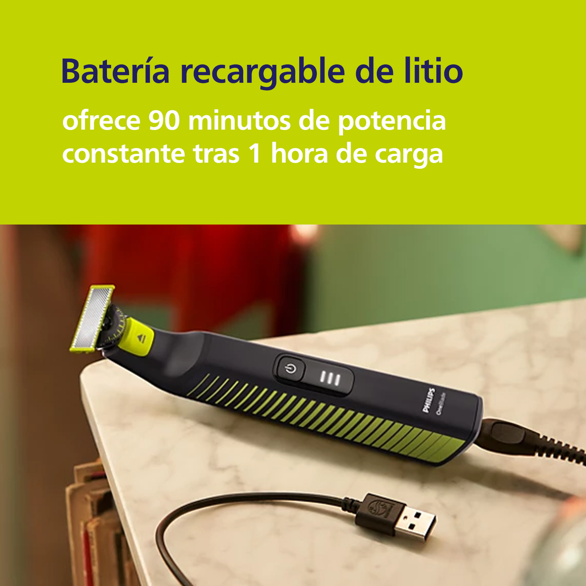 Czarny i zielony trymer elektryczny z kablem USB, spoczywający na białej powierzchni w pobliżu portu USB.