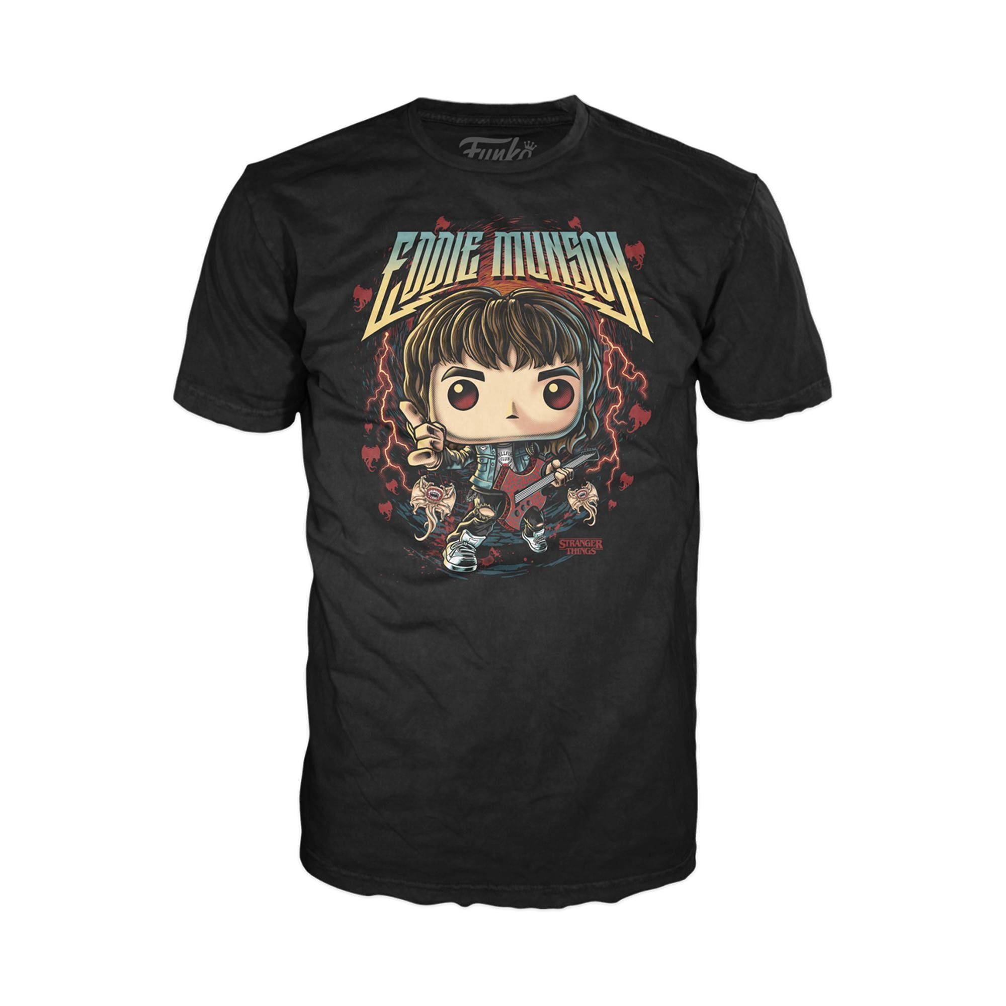T-shirt nera con un cartone animato di un ragazzo. Sta tenendo una chitarra e fa un gesto rock.