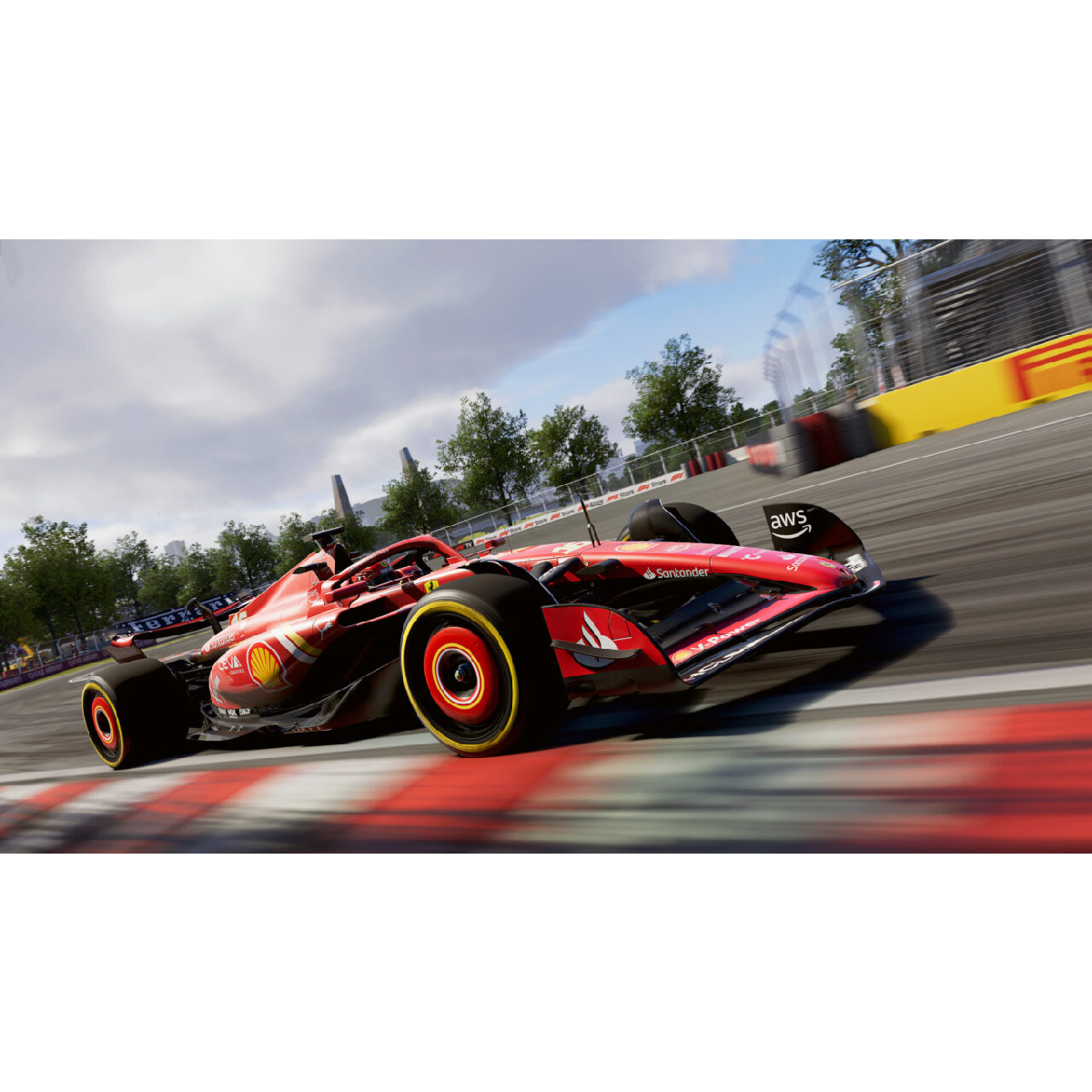 Czerwony bolid Formuły 1 ściga się na torze. Tor ma czerwono-białe linie i niebieskie niebo.