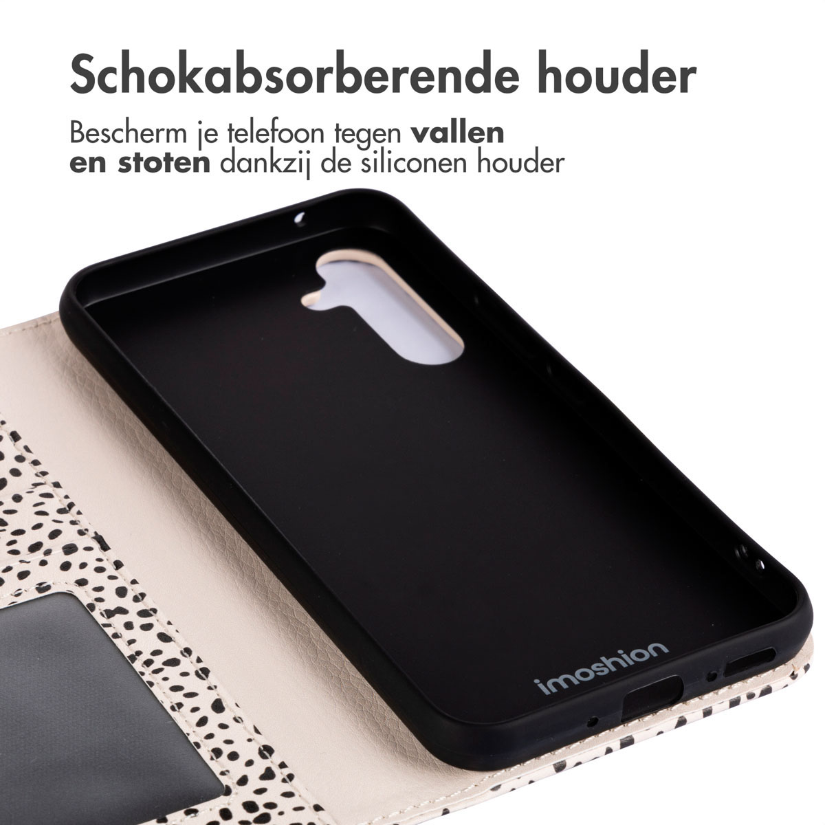Coque de téléphone avec dos noir et points blancs. La coque est ouverte.