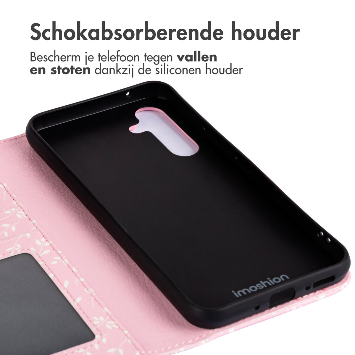 Telefoonhoesje binnenkant, zwart met bloemenpatroon, op een roze oppervlak, open.