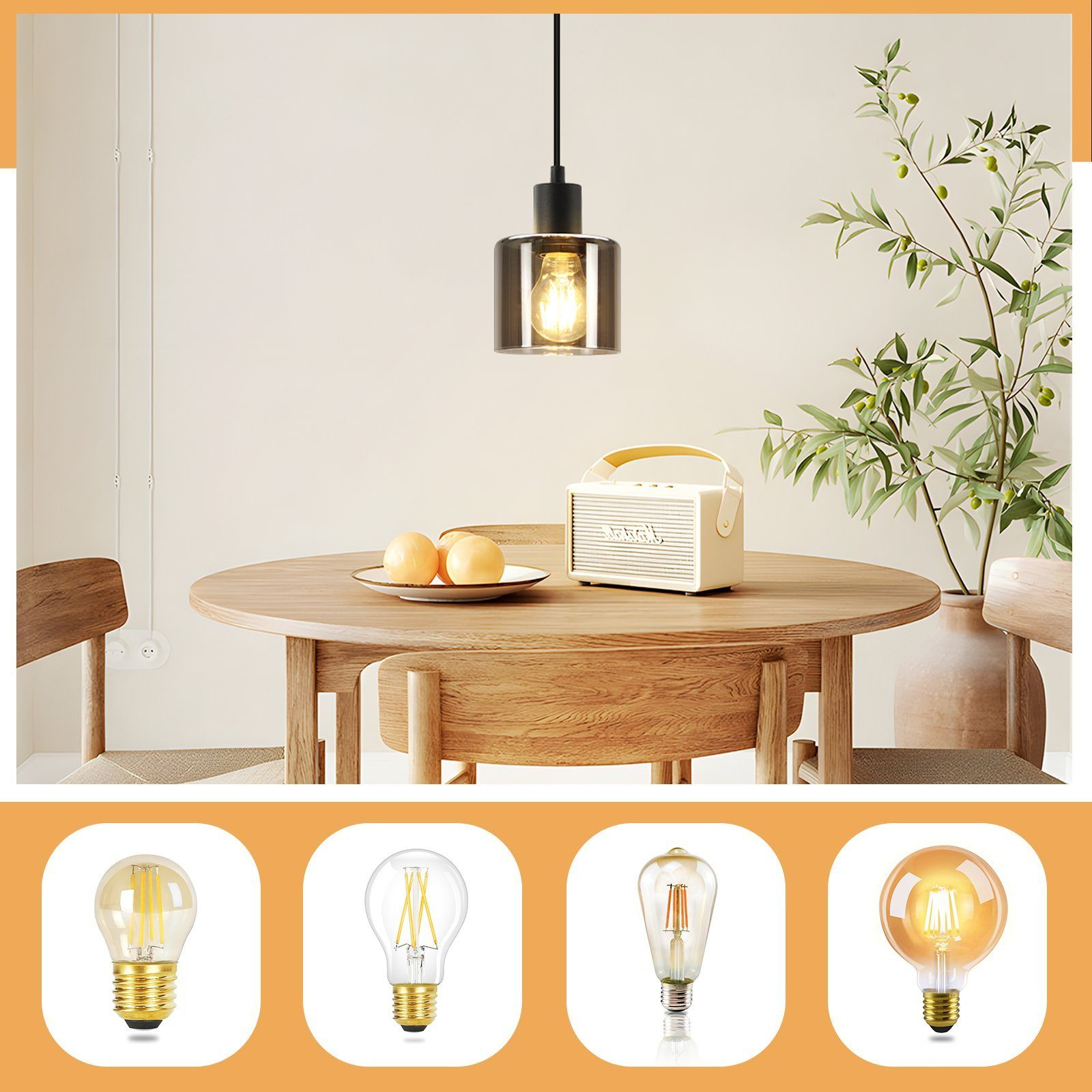 Una lampada a sospensione con una lampadina, su un tavolo con arance e un altoparlante. Quattro lampadine diverse sotto.
