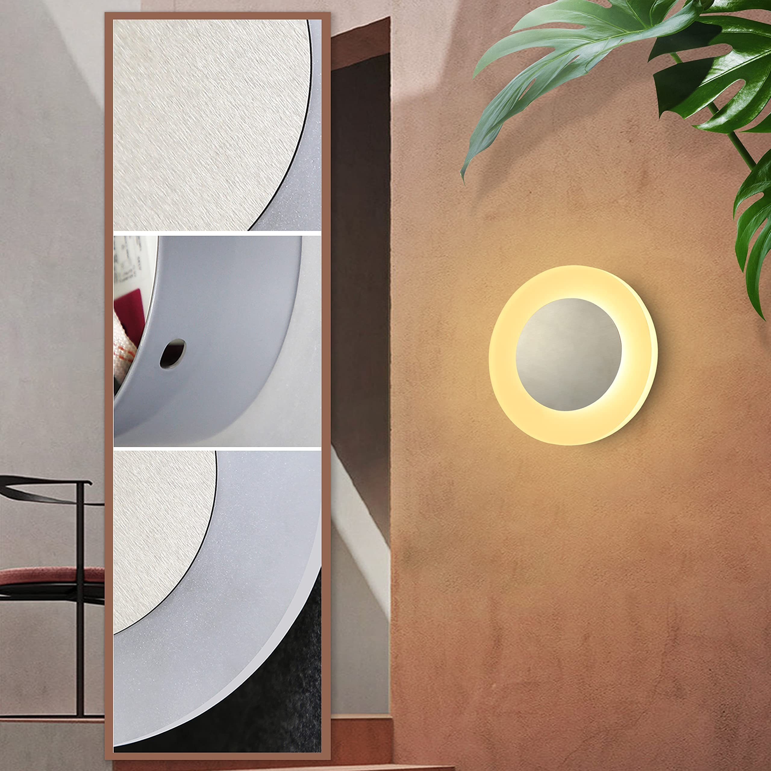 Un espejo grande junto a una pared con una lámpara de pared.