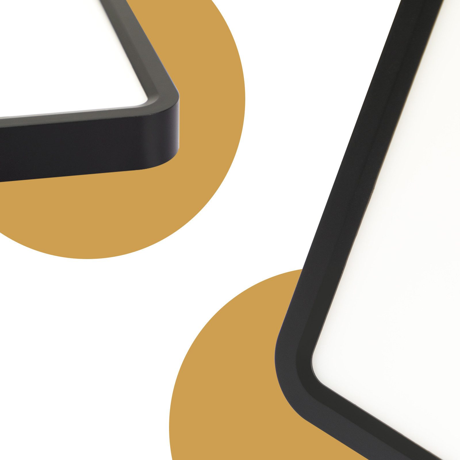 Primo piano dell'angolo di una lampada LED quadrata con cornice nera. L'angolo è arrotondato.